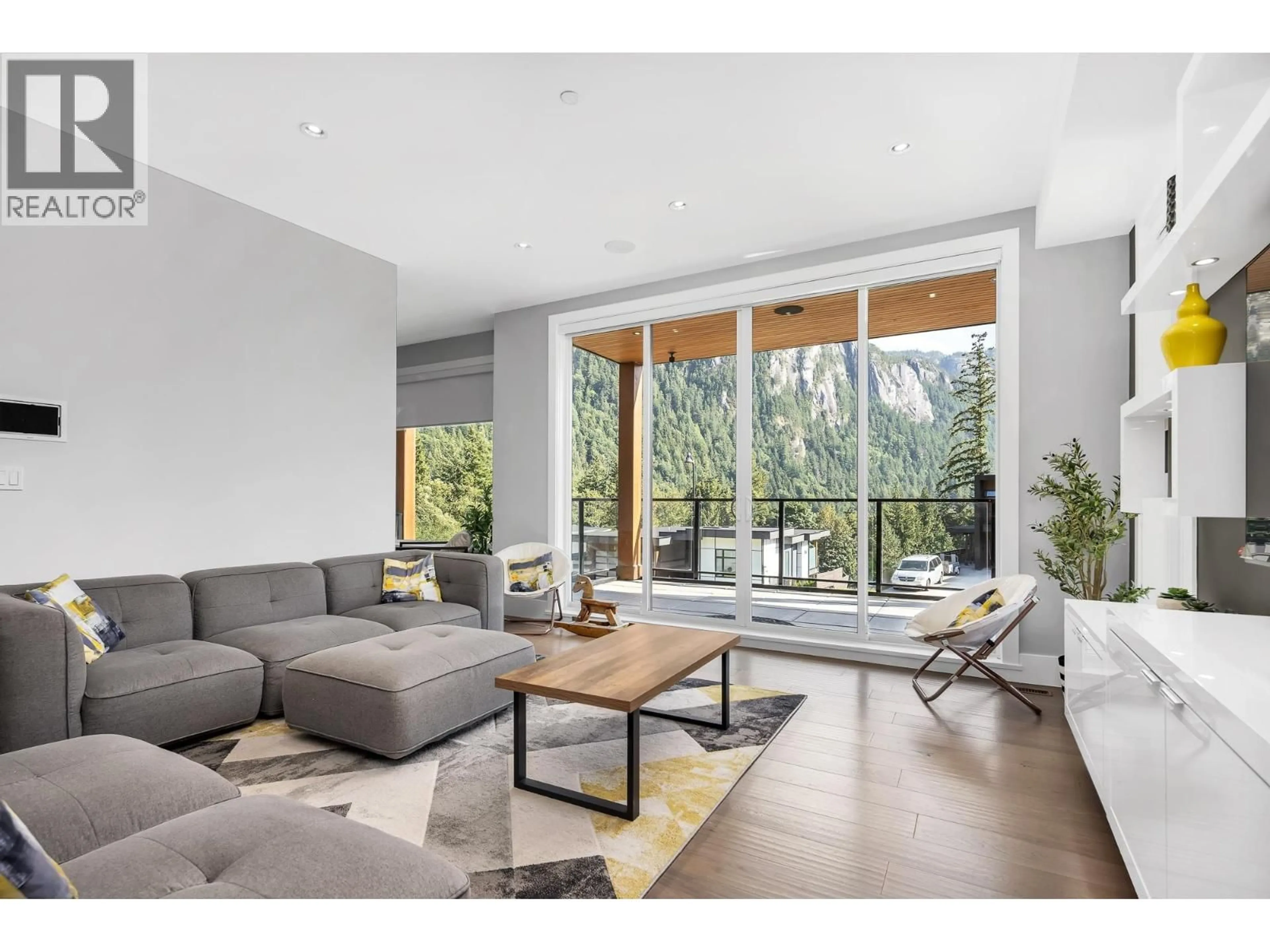 Living room with furniture, wood/laminate floor for 2213 WINDSAIL PLACE, Squamish British Columbia V8B0T6