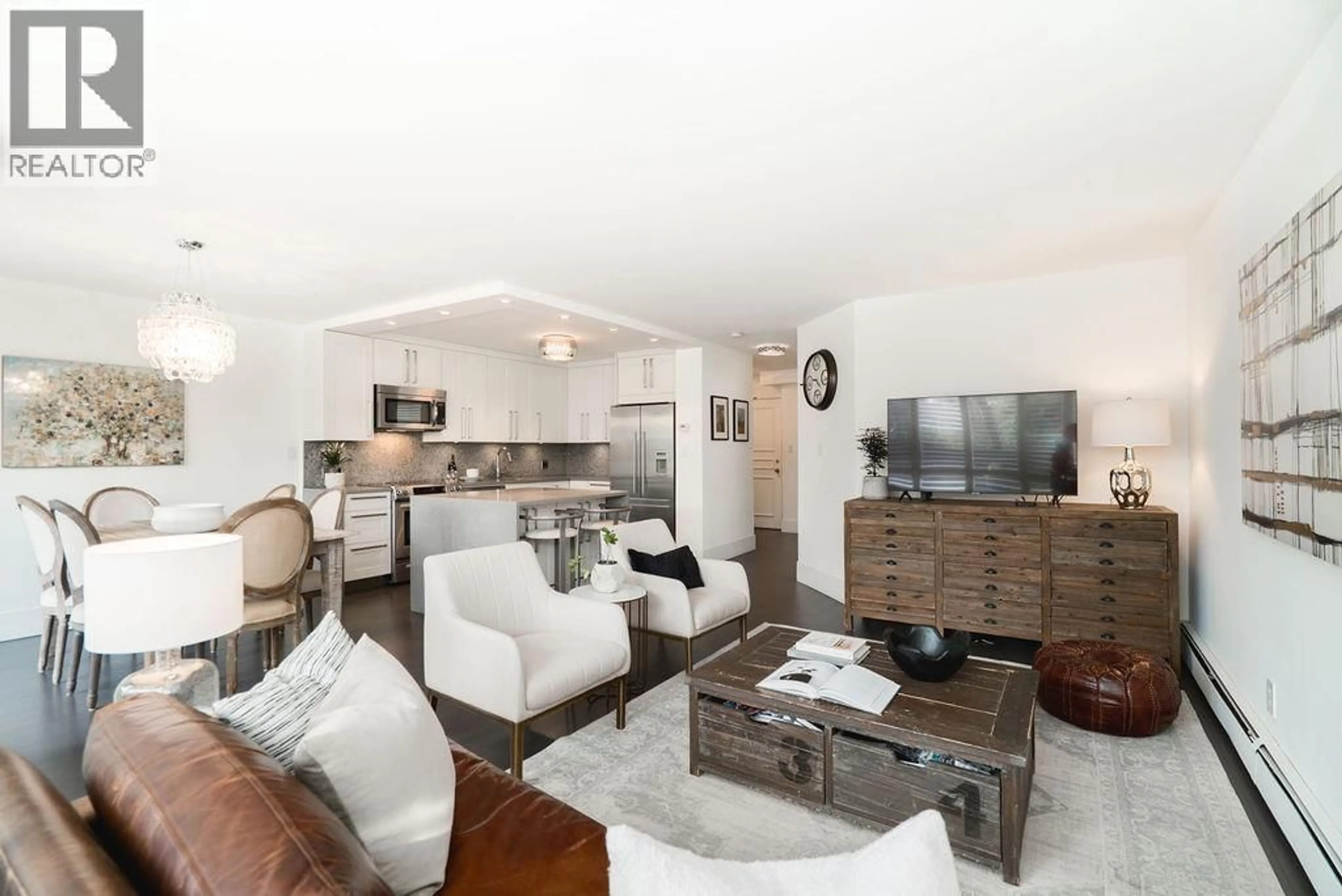 Living room with furniture, wood/laminate floor for 105 - 518 MOBERLY ROAD, Vancouver British Columbia V5Z4G3