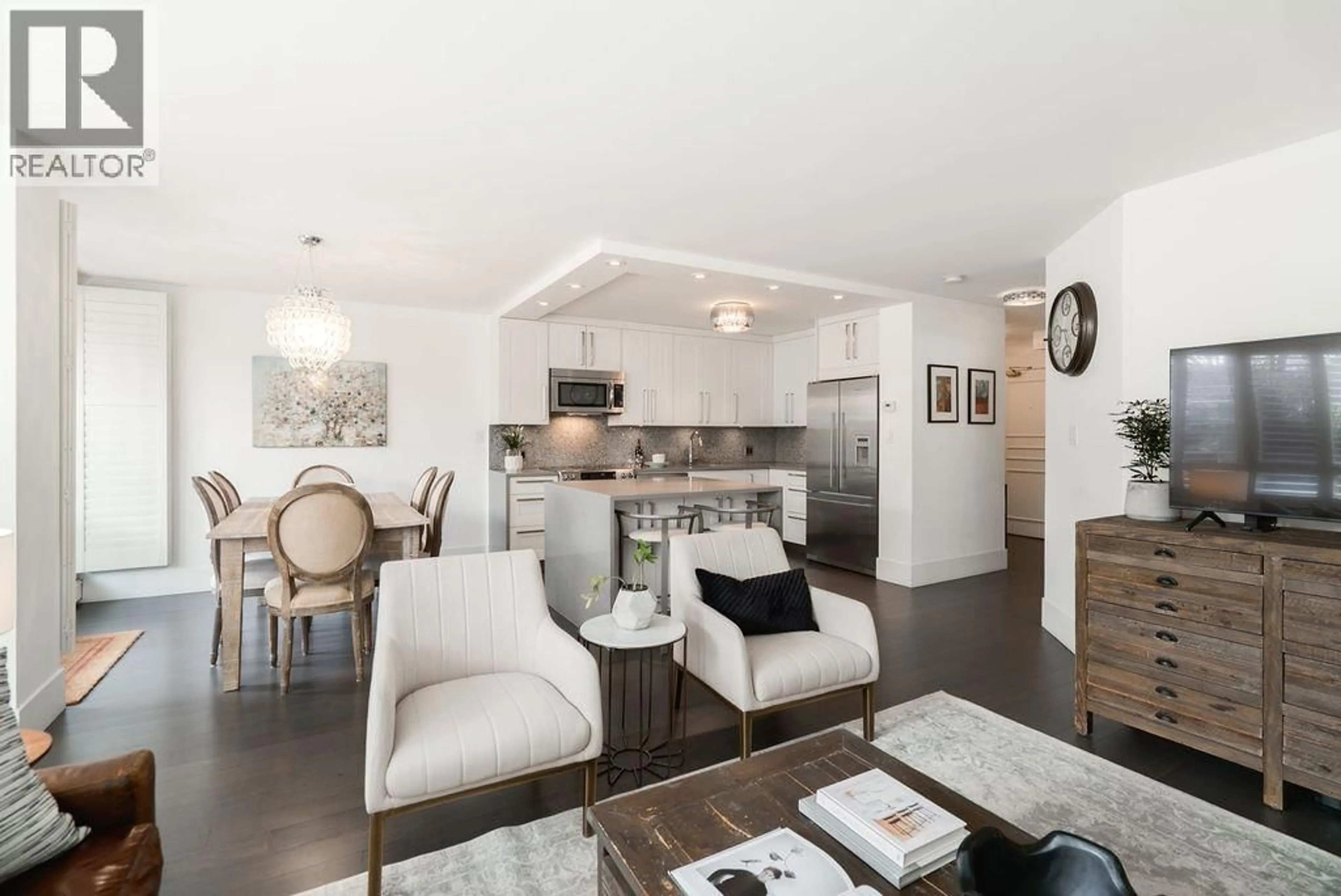 Open concept kitchen, wood/laminate floor for 105 - 518 MOBERLY ROAD, Vancouver British Columbia V5Z4G3