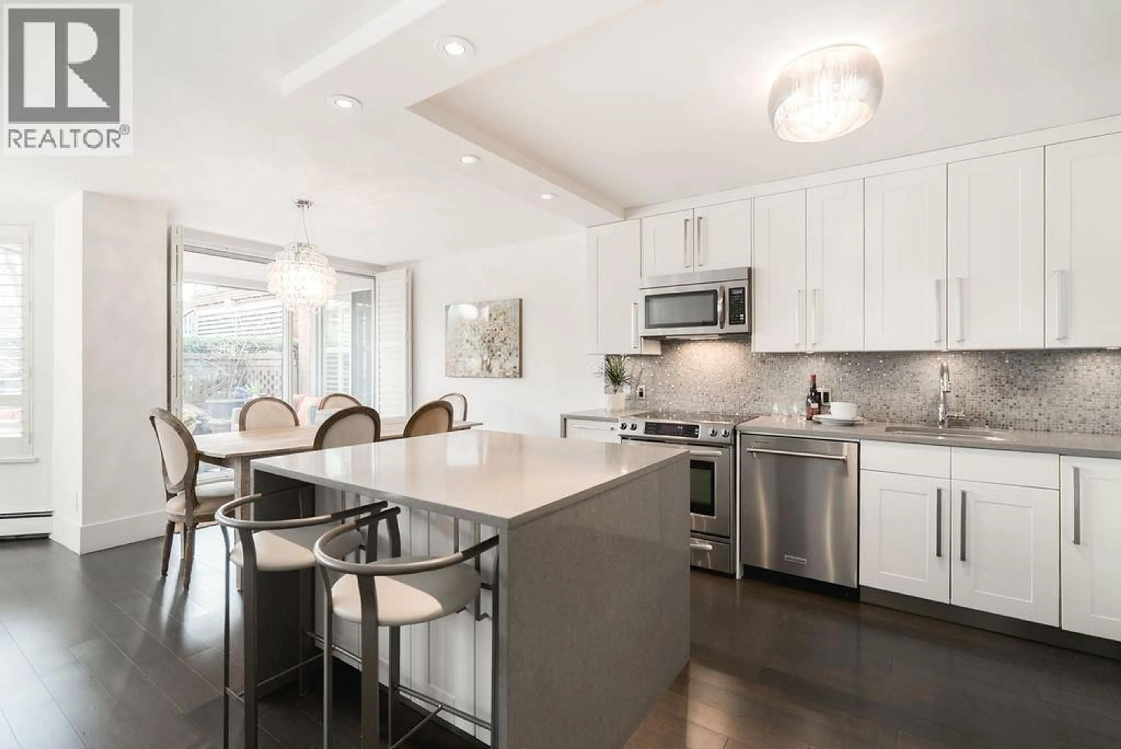 Open concept kitchen, ceramic/tile floor for 105 - 518 MOBERLY ROAD, Vancouver British Columbia V5Z4G3