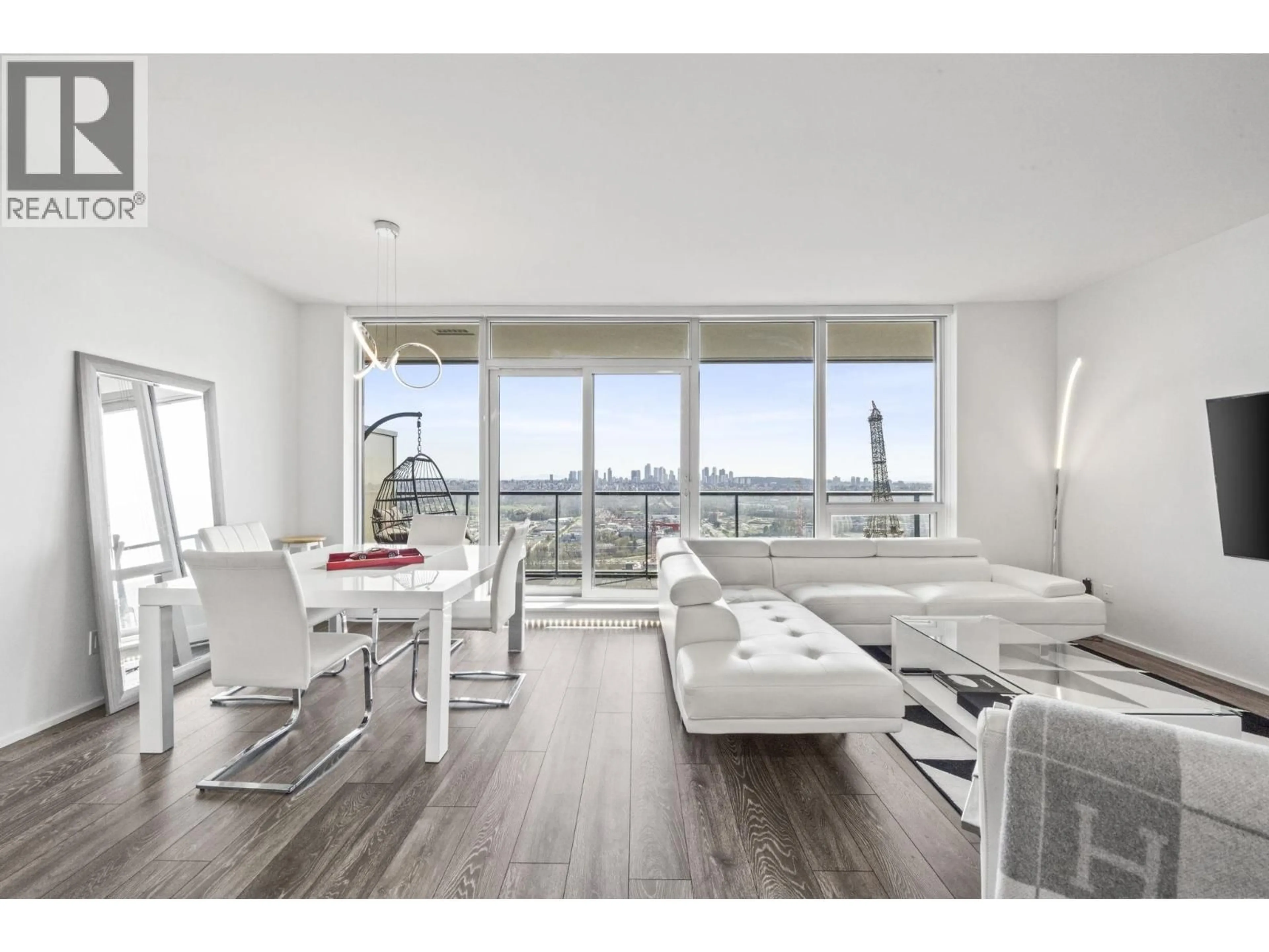 Living room with furniture, wood/laminate floor for 5303 - 1955 ALPHA WAY, Burnaby British Columbia V5C0K6