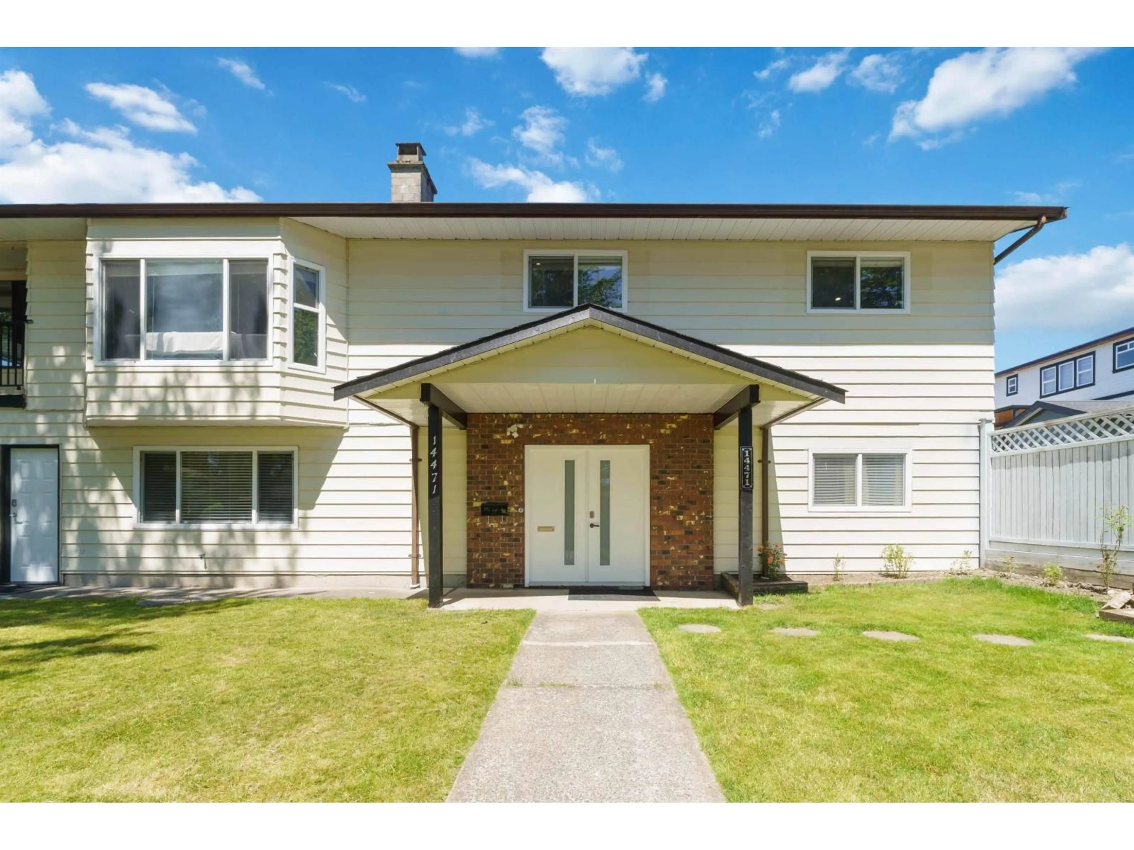 Home with vinyl exterior material, street for 14471 85A AVENUE, Surrey British Columbia V3S5W3