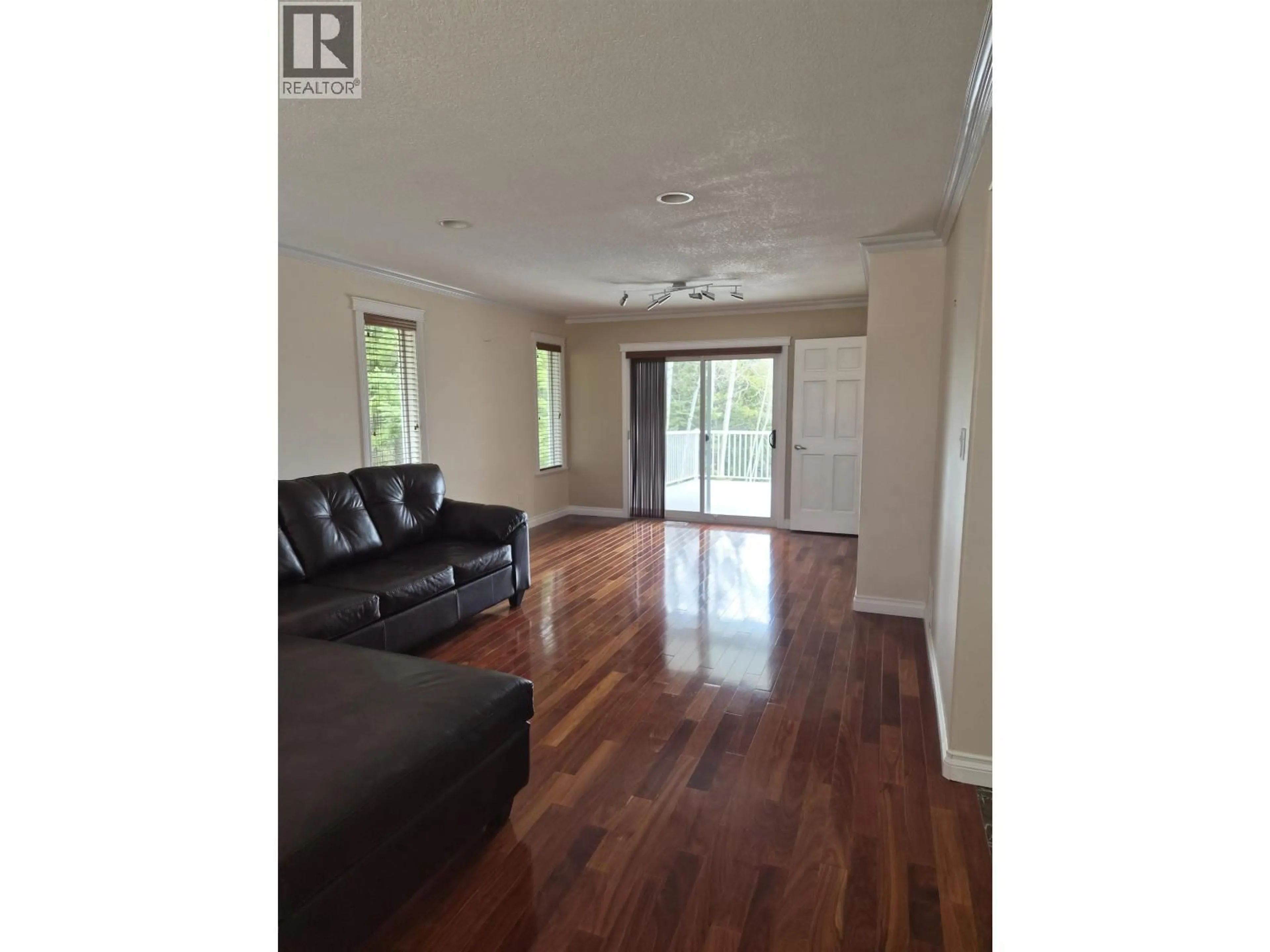 Living room with furniture, wood/laminate floor for 7830 ST MARY PLACE, Prince George British Columbia V2N7A5