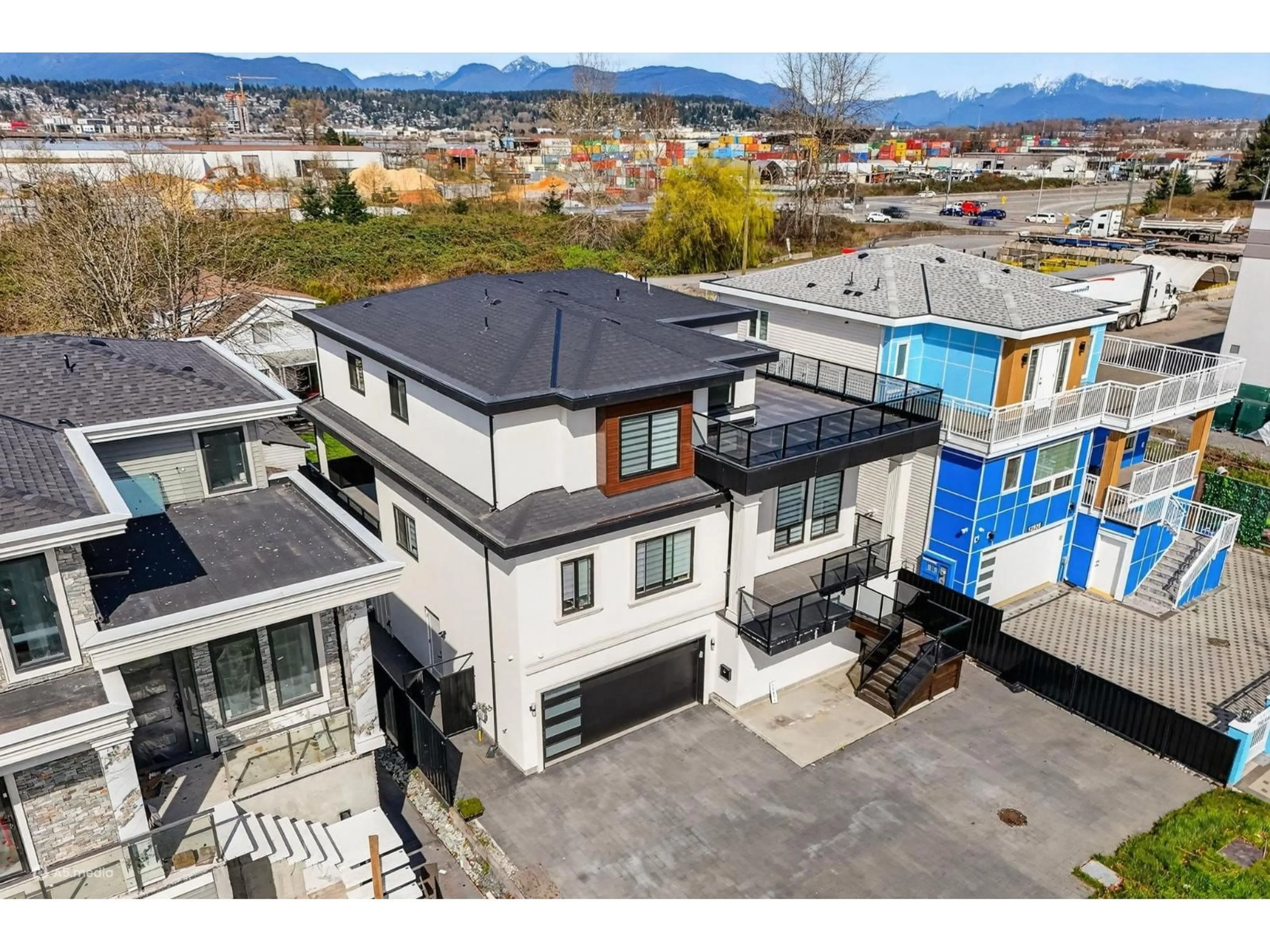 A pic from outside/outdoor area/front of a property/back of a property/a pic from drone, mountain view for 12927 115A AVENUE, Surrey British Columbia V3R2R3