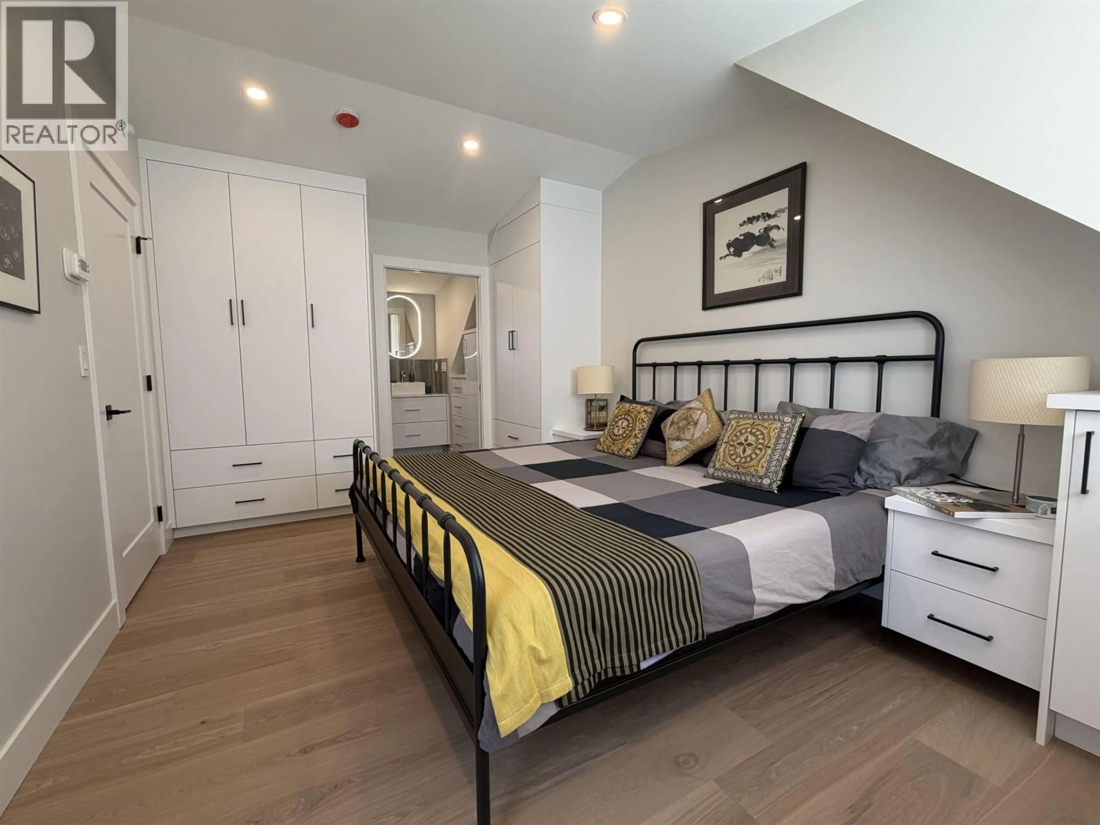 Bedroom with bed, wood/laminate floor for 3760 FLEMING STREET, Vancouver British Columbia V5N3W2