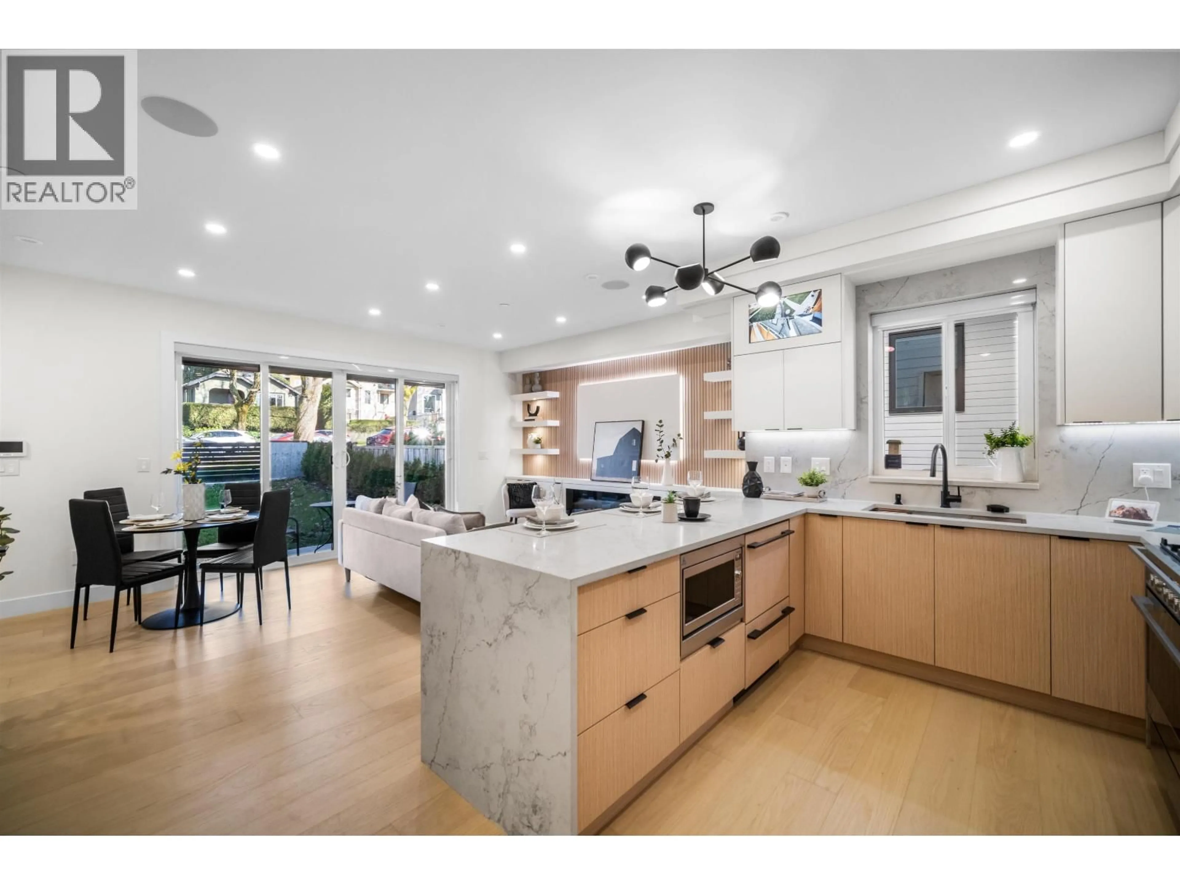 Open concept kitchen, ceramic/tile floor for 1 - 3576 PENDER STREET, Vancouver British Columbia V5K2E3