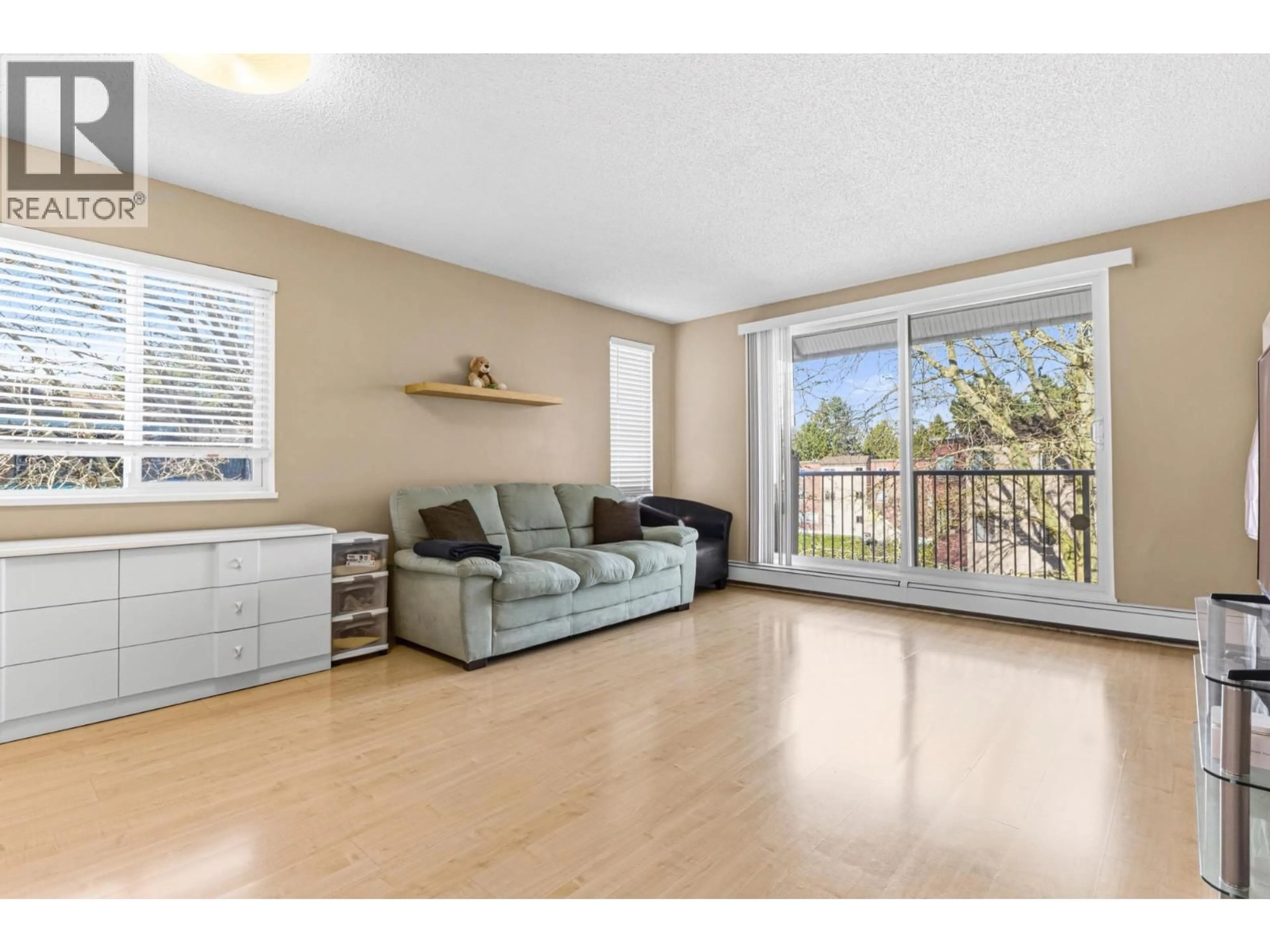Living room with furniture, wood/laminate floor for 302 - 8870 CITATION DRIVE, Richmond British Columbia V6Y3A3