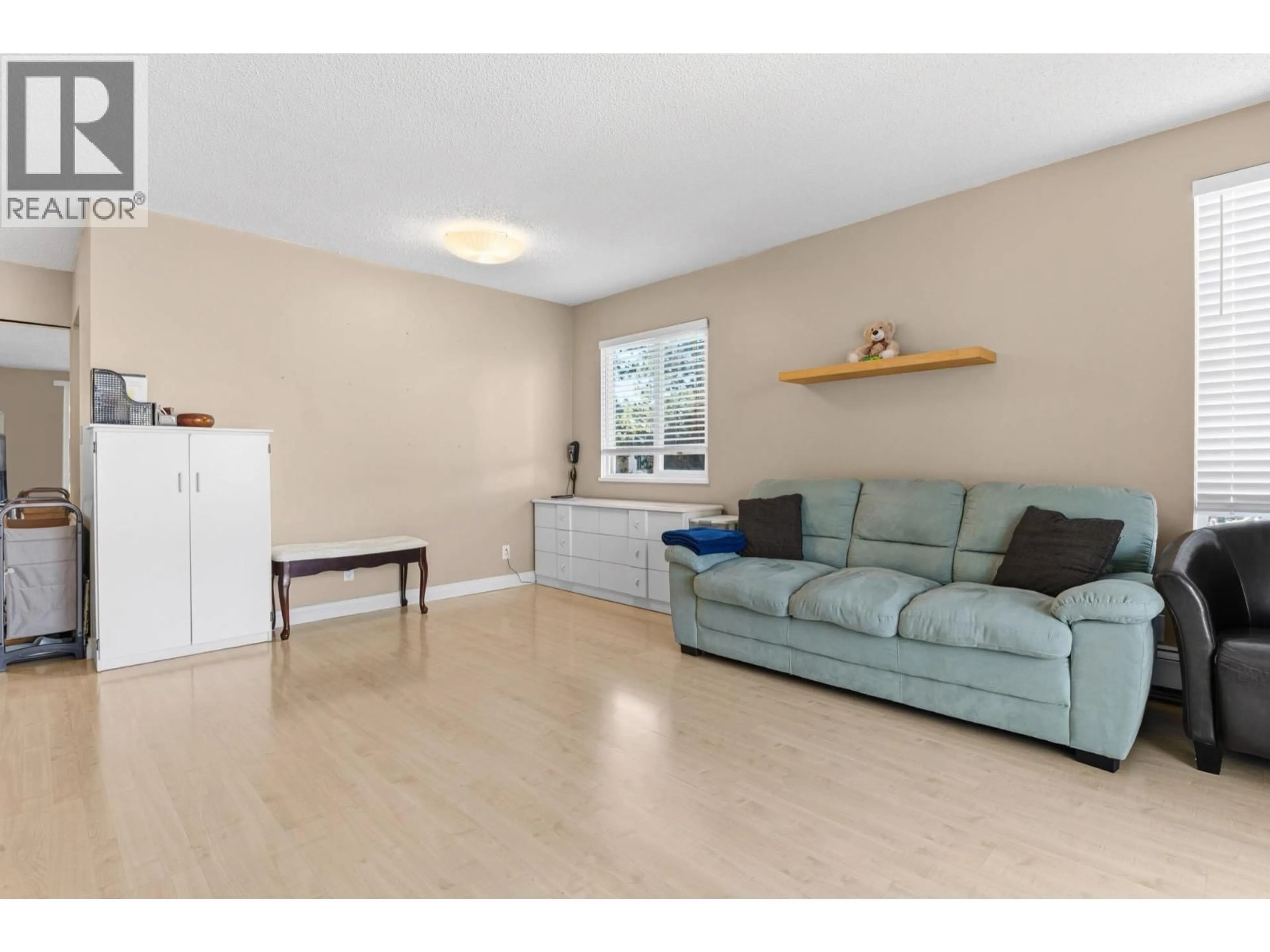 Living room with furniture, wood/laminate floor for 302 - 8870 CITATION DRIVE, Richmond British Columbia V6Y3A3