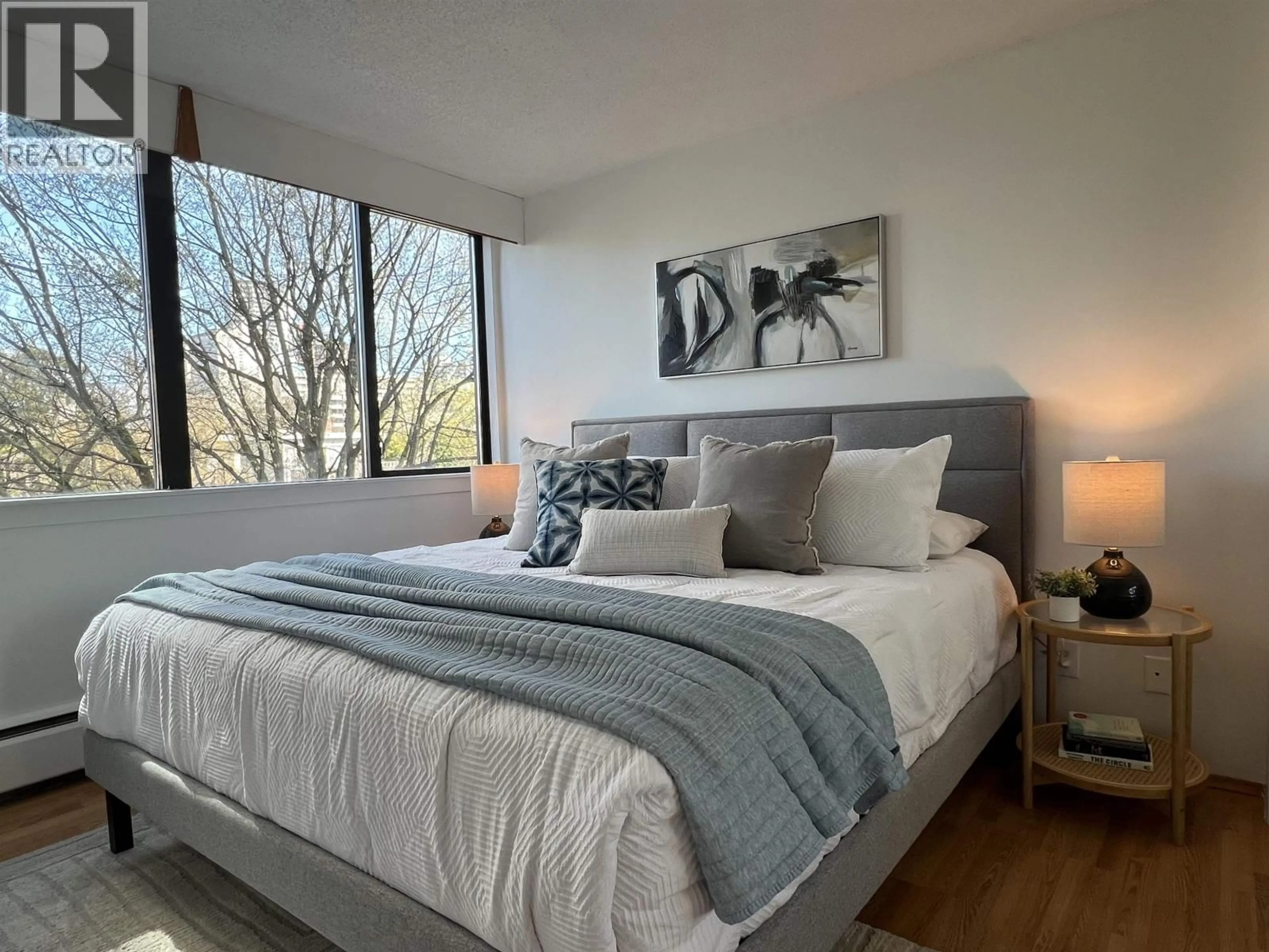 Bedroom with bed, wood/laminate floor for 503 - 1740 COMOX STREET, Vancouver British Columbia V6G2Z1