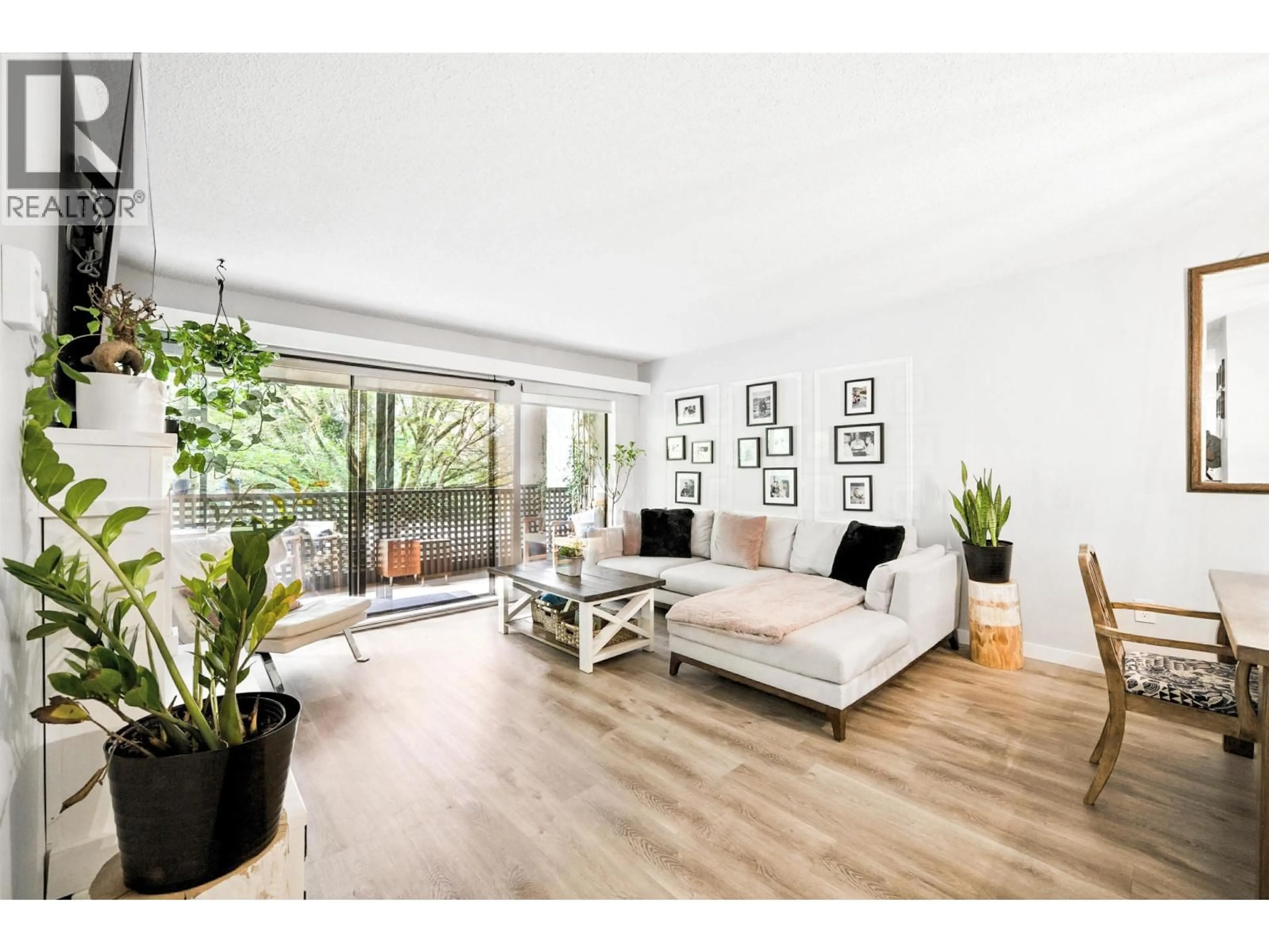 Living room with furniture, wood/laminate floor for 212 - 1955 WOODWAY PLACE, Burnaby British Columbia V5B4S5
