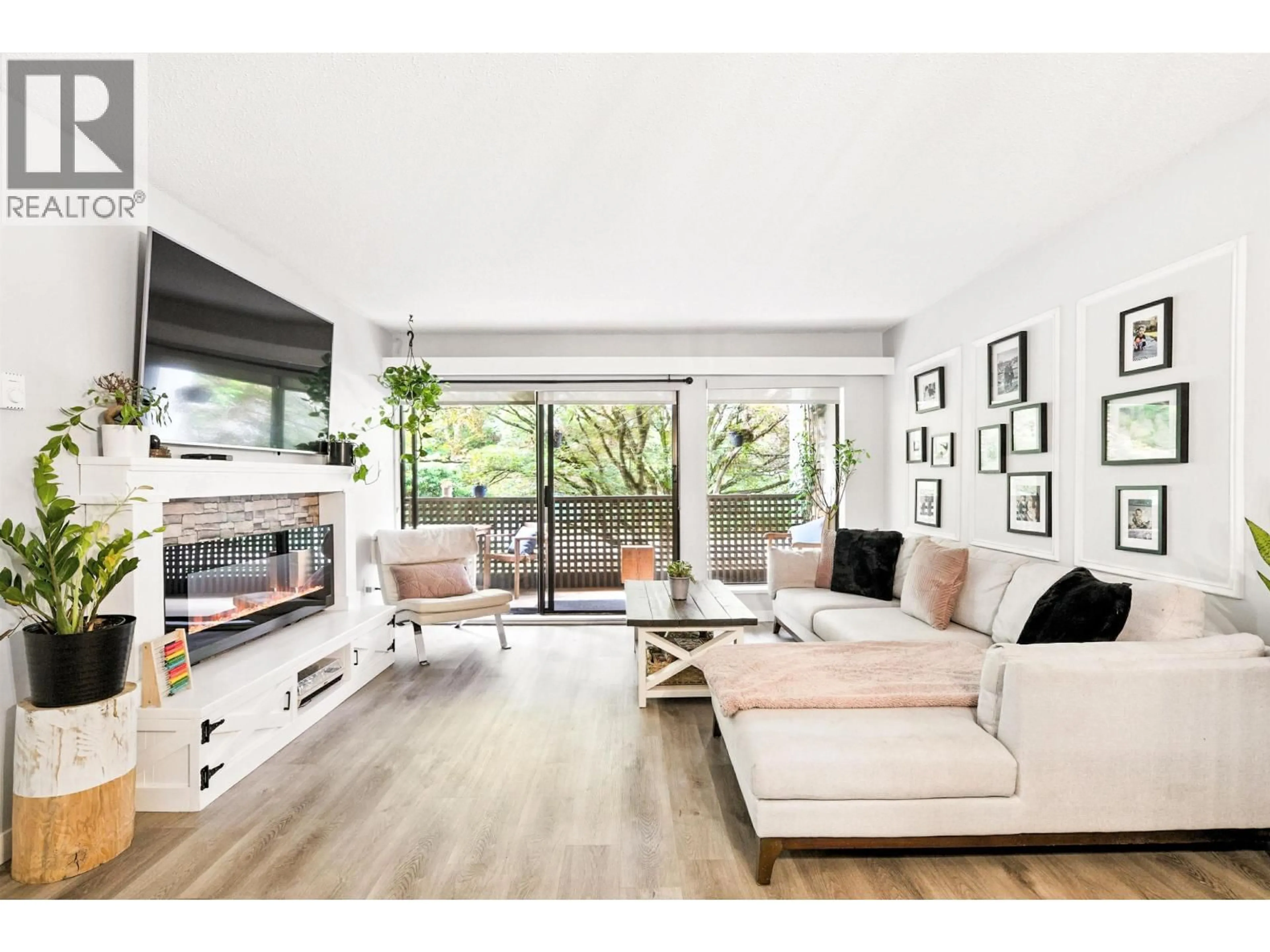 Living room with furniture, wood/laminate floor for 212 - 1955 WOODWAY PLACE, Burnaby British Columbia V5B4S5