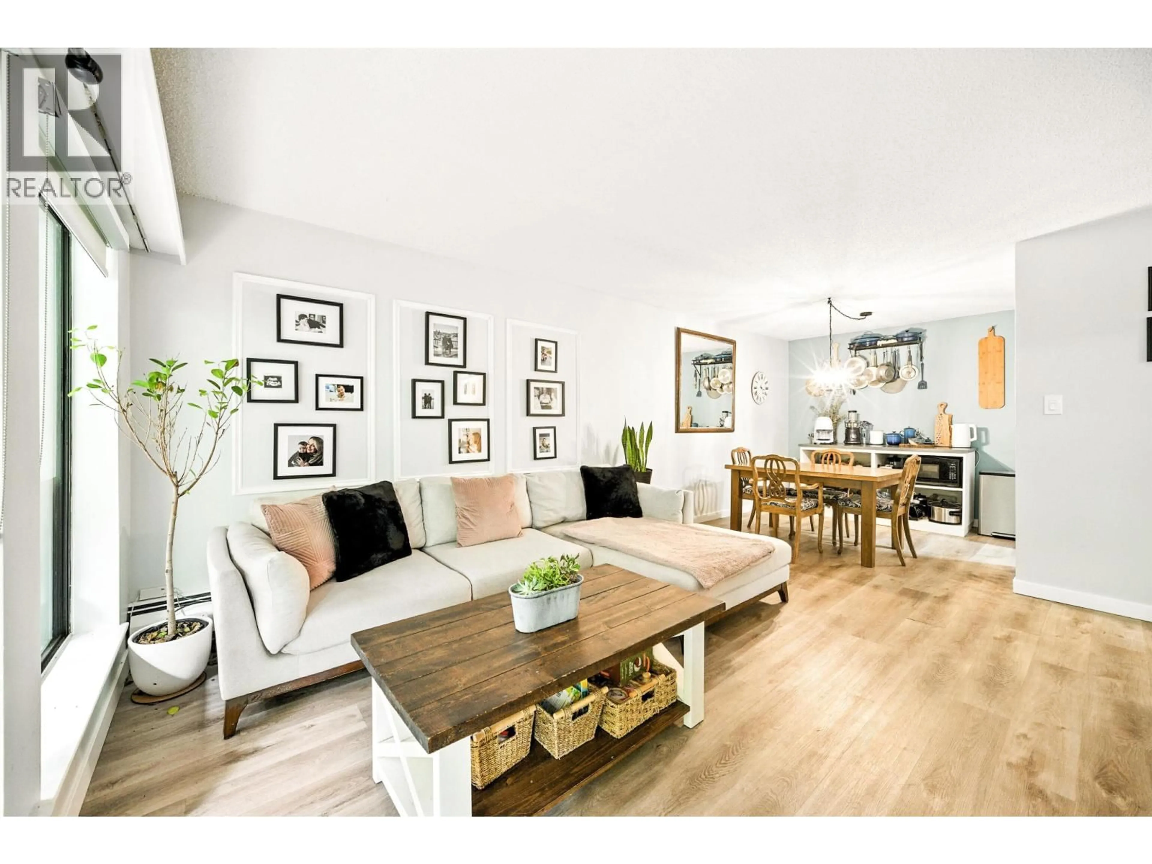 Living room with furniture, wood/laminate floor for 212 - 1955 WOODWAY PLACE, Burnaby British Columbia V5B4S5