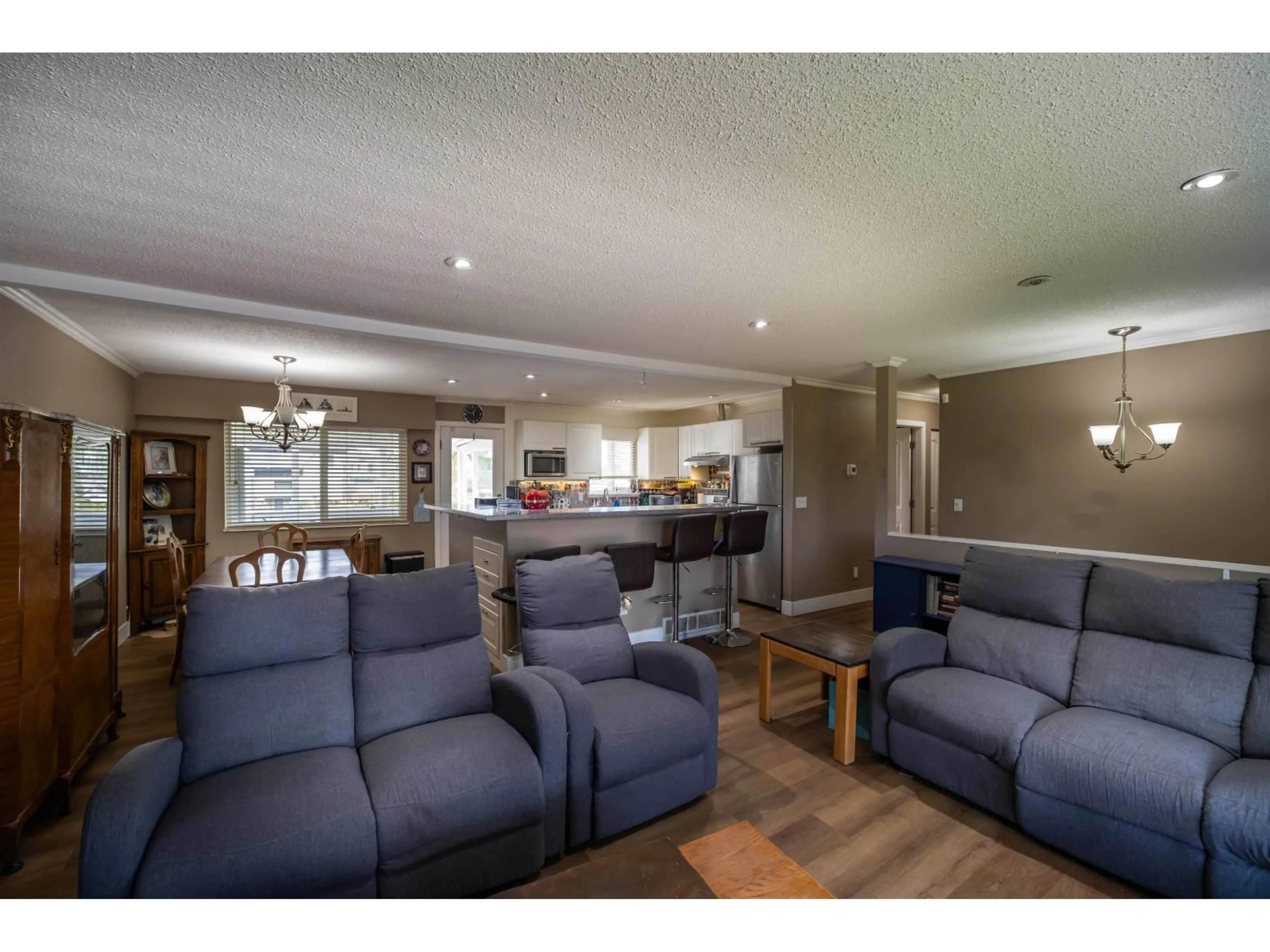 Living room with furniture, wood/laminate floor for 17884 57 AVENUE, Surrey British Columbia V3S1H3