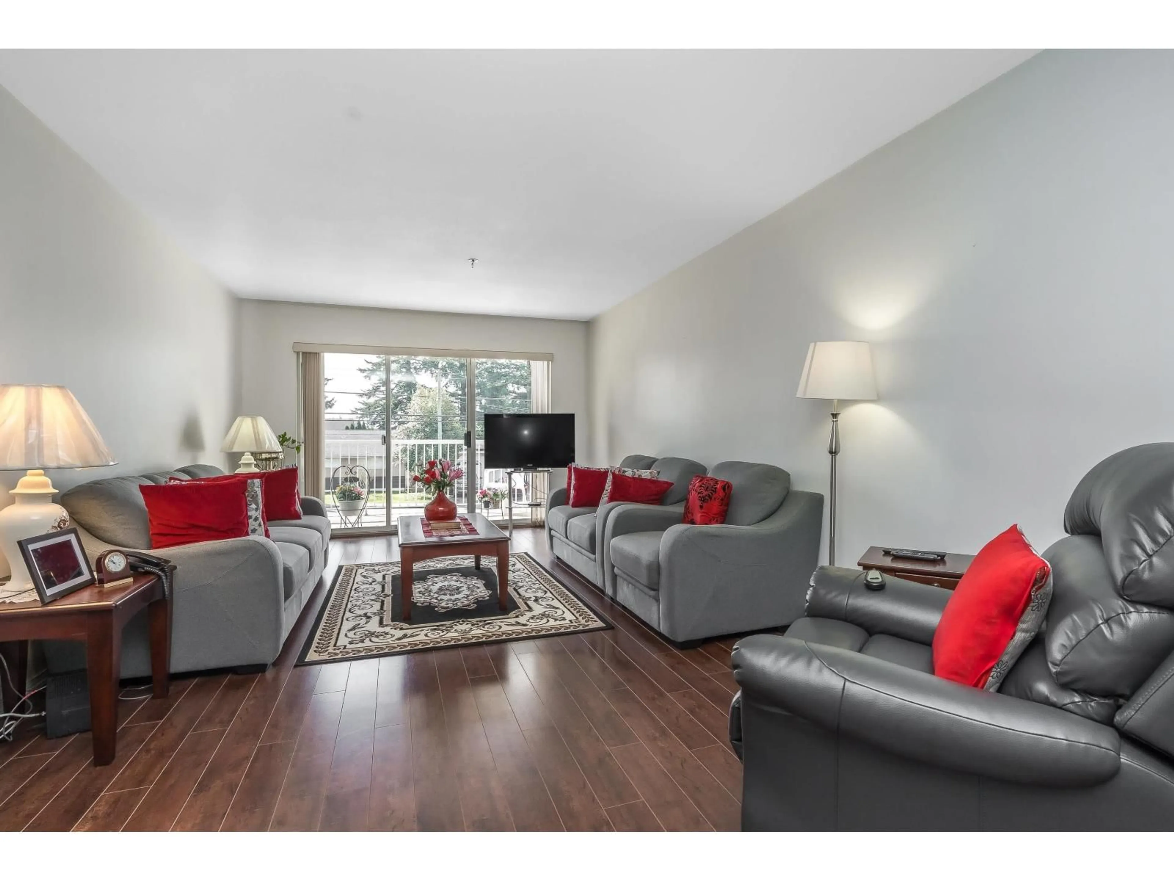 Living room with furniture, wood/laminate floor for 215 - 33535 KING ROAD, Abbotsford British Columbia V2S6Z5