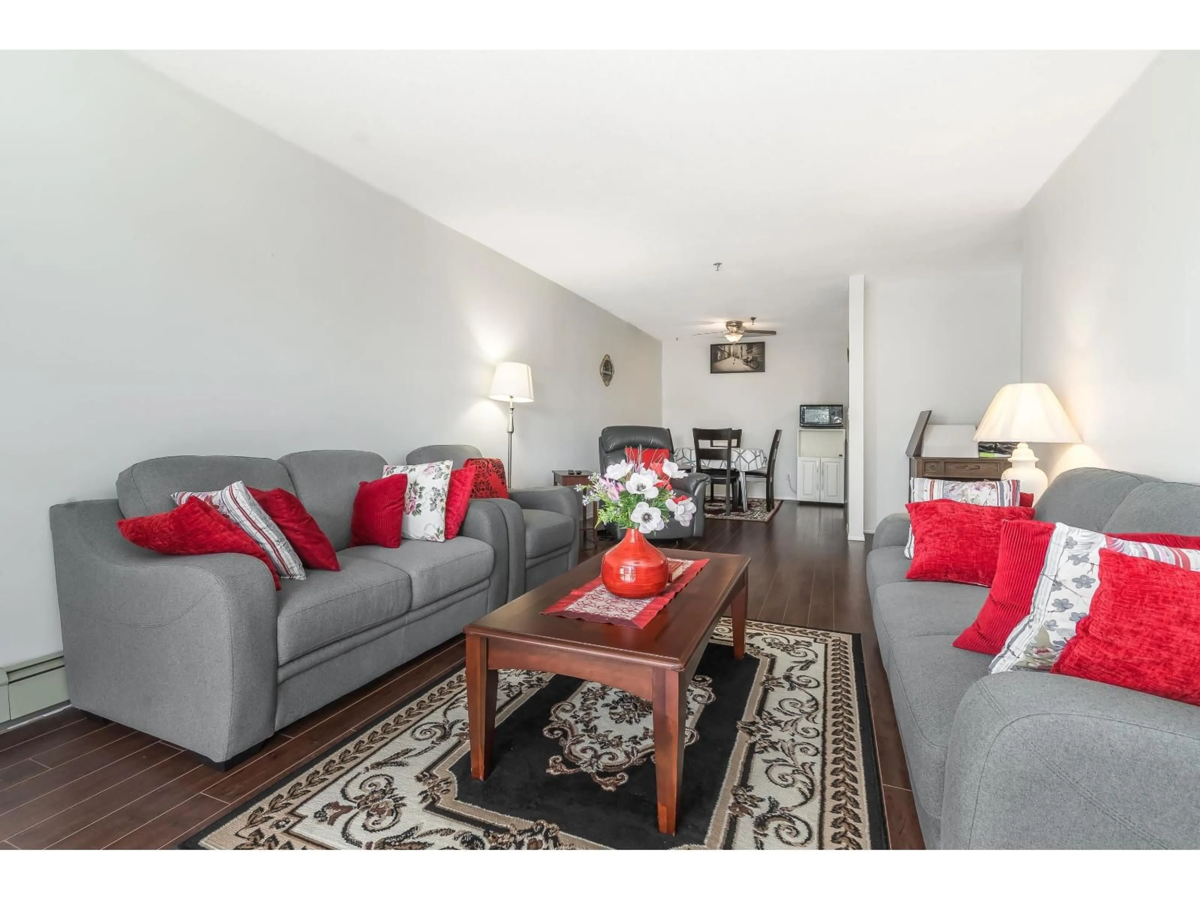 Living room with furniture, wood/laminate floor for 215 - 33535 KING ROAD, Abbotsford British Columbia V2S6Z5