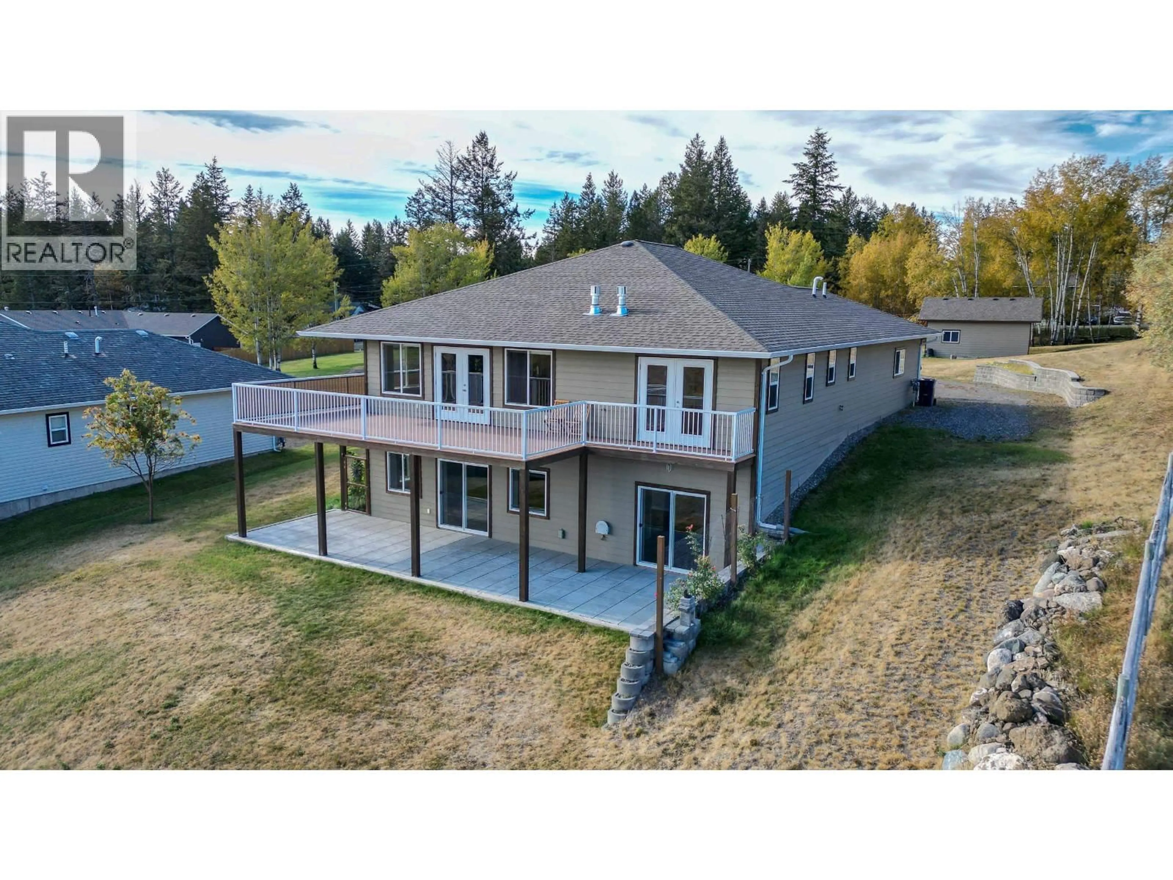 A pic from outside/outdoor area/front of a property/back of a property/a pic from drone, unknown for 5072 BLOCK DRIVE, 108 Mile Ranch British Columbia V0K2Z0