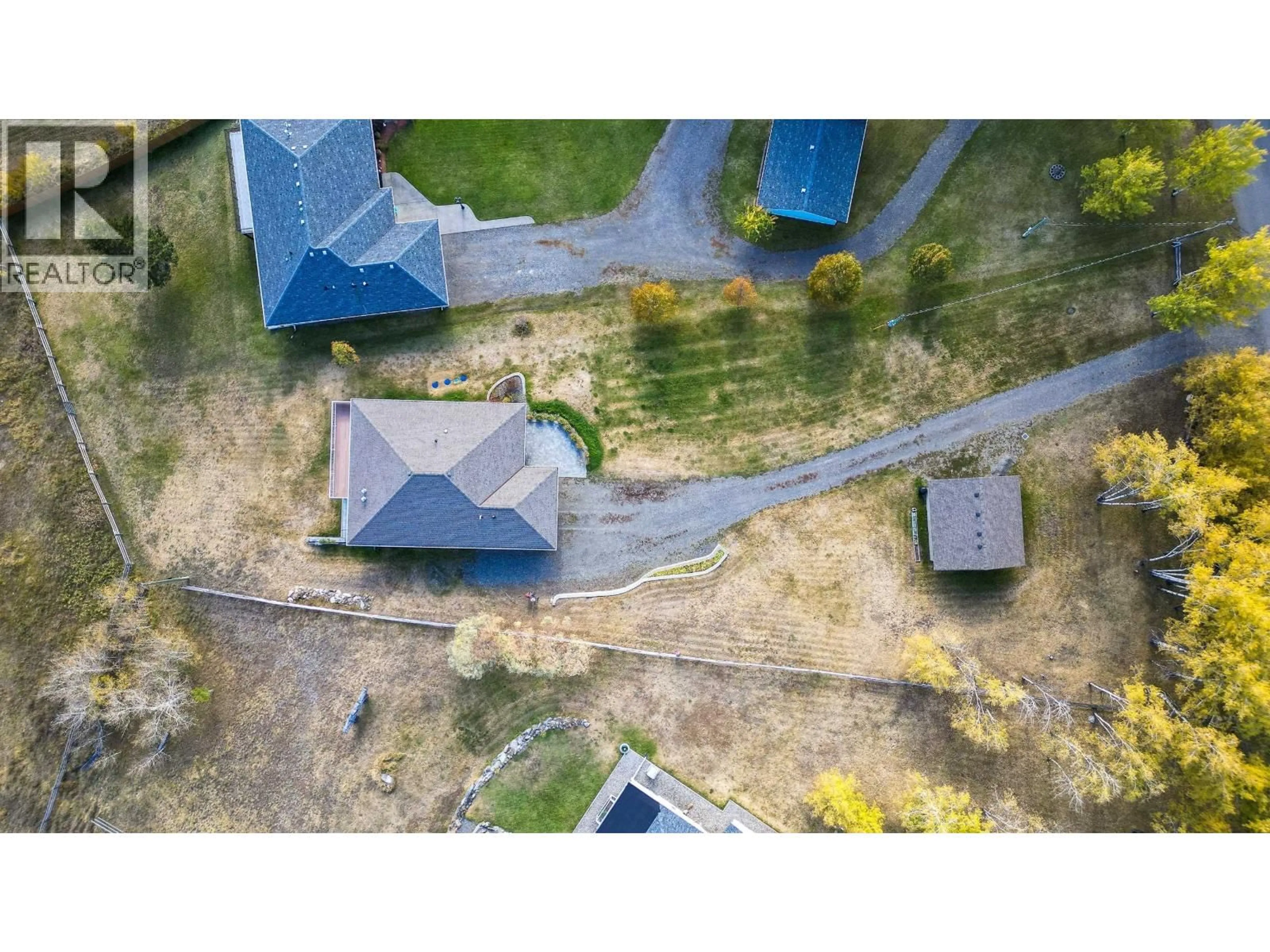 A pic from outside/outdoor area/front of a property/back of a property/a pic from drone, street for 5072 BLOCK DRIVE, 108 Mile Ranch British Columbia V0K2Z0