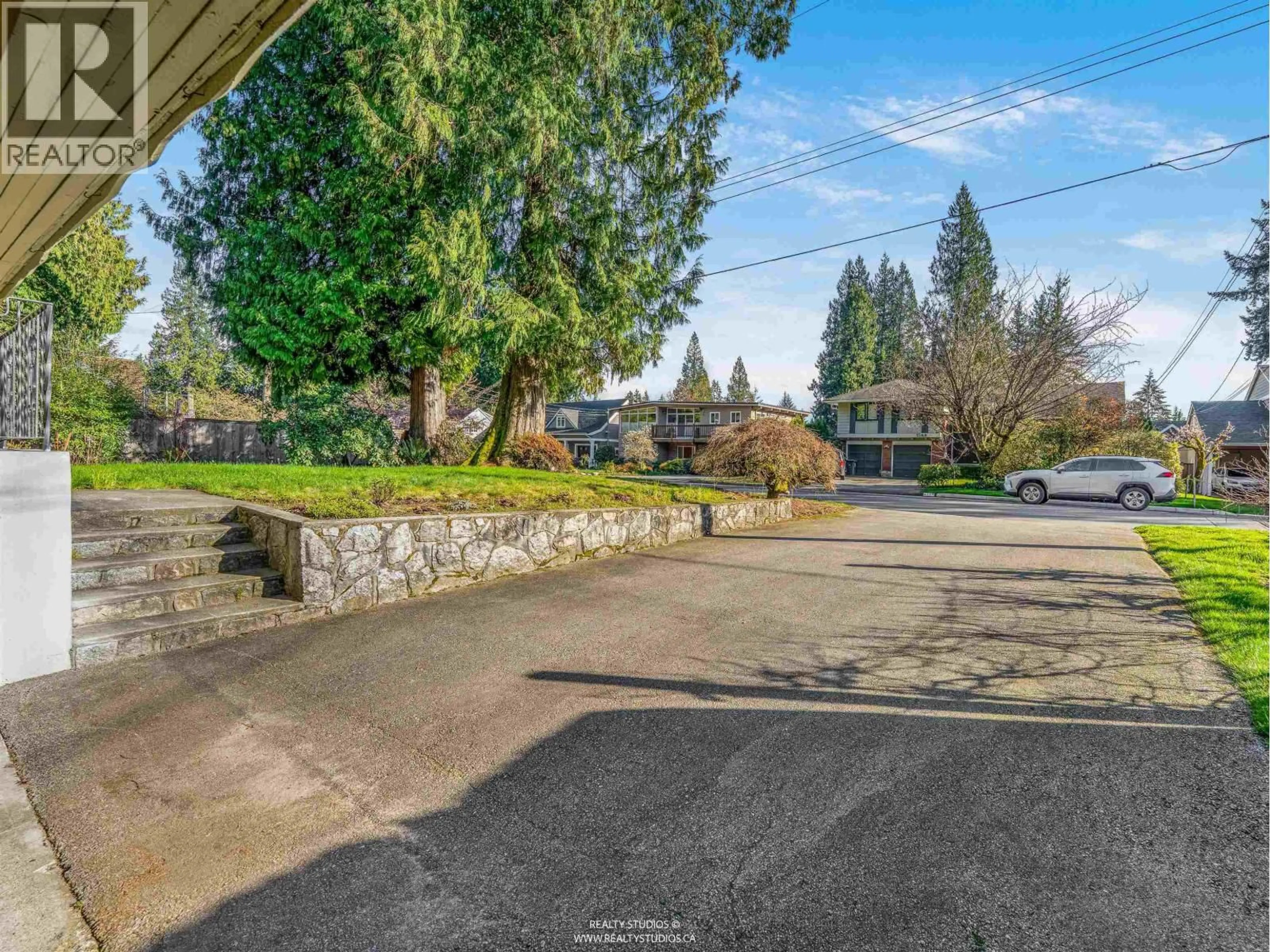 A pic from outside/outdoor area/front of a property/back of a property/a pic from drone, street for 1110 LODGE ROAD, North Vancouver British Columbia V7R1W8