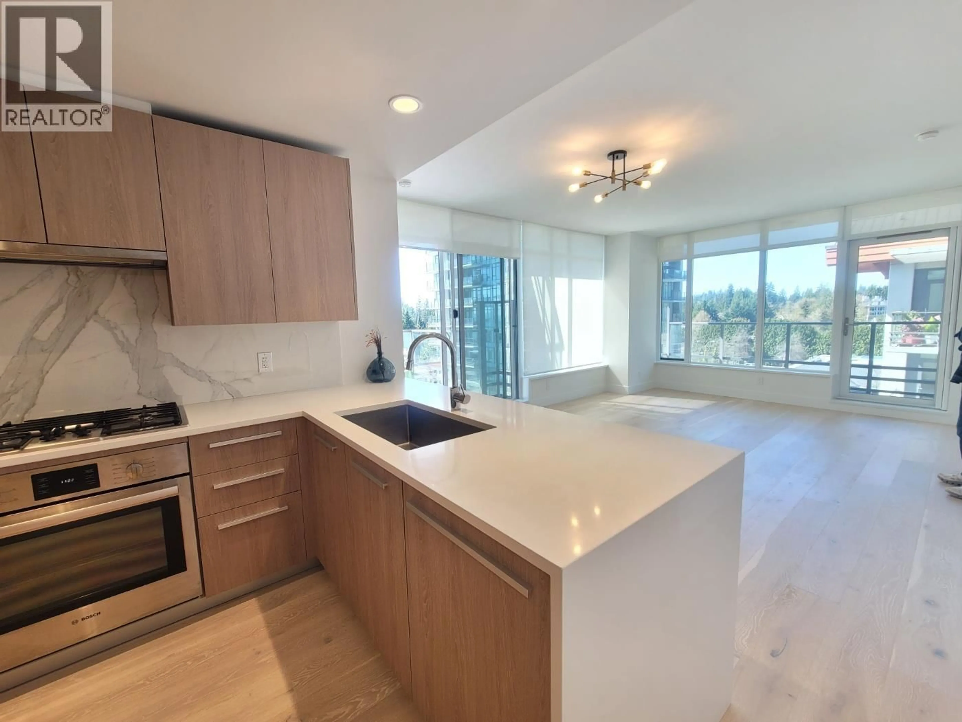 Open concept kitchen, ceramic/tile floor for 608 - 2785 LIBRARY LANE, North Vancouver British Columbia V7J0C3