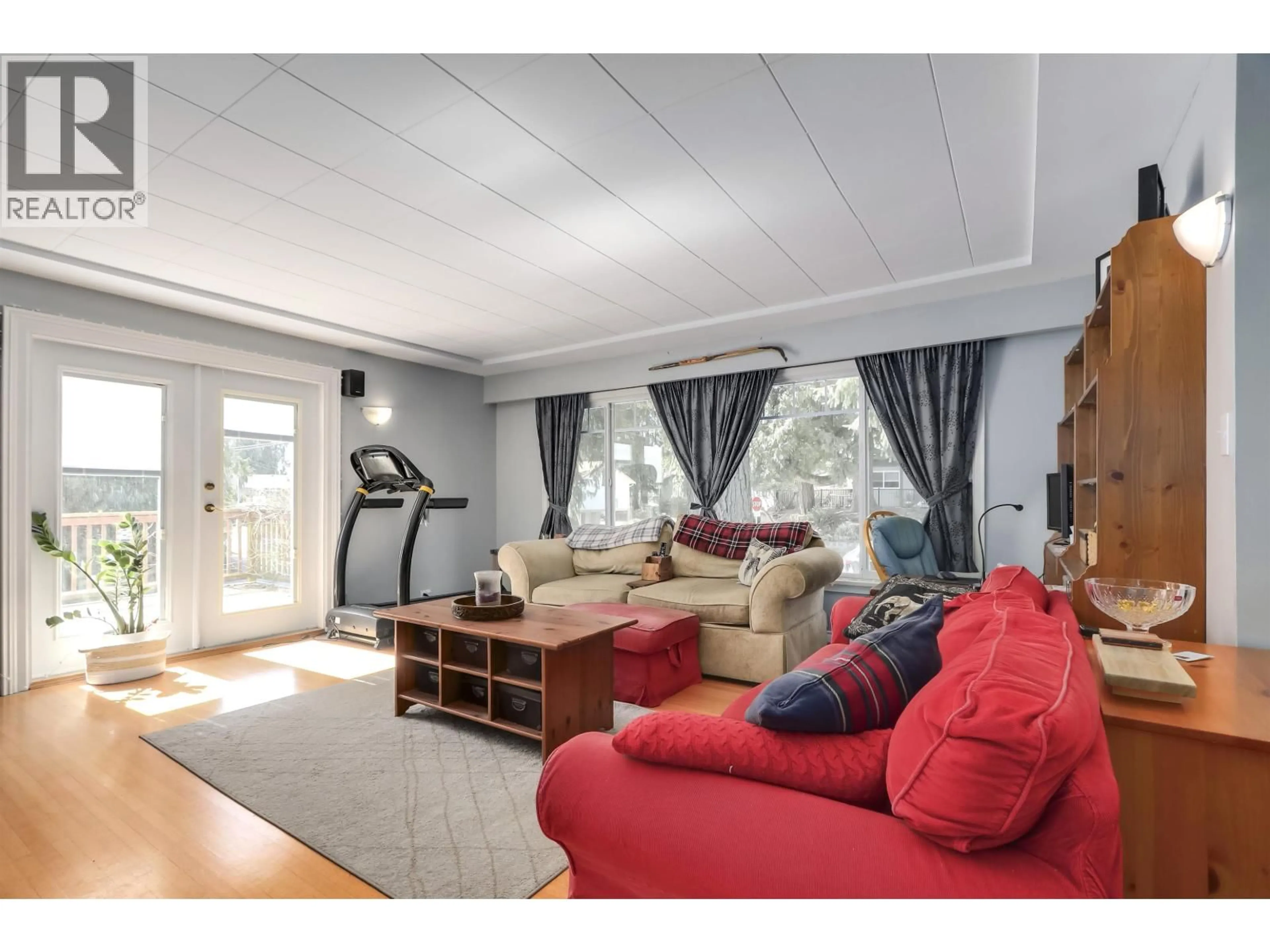 Living room with furniture, wood/laminate floor for 3530 HASTINGS STREET, Port Coquitlam British Columbia V3B4N4