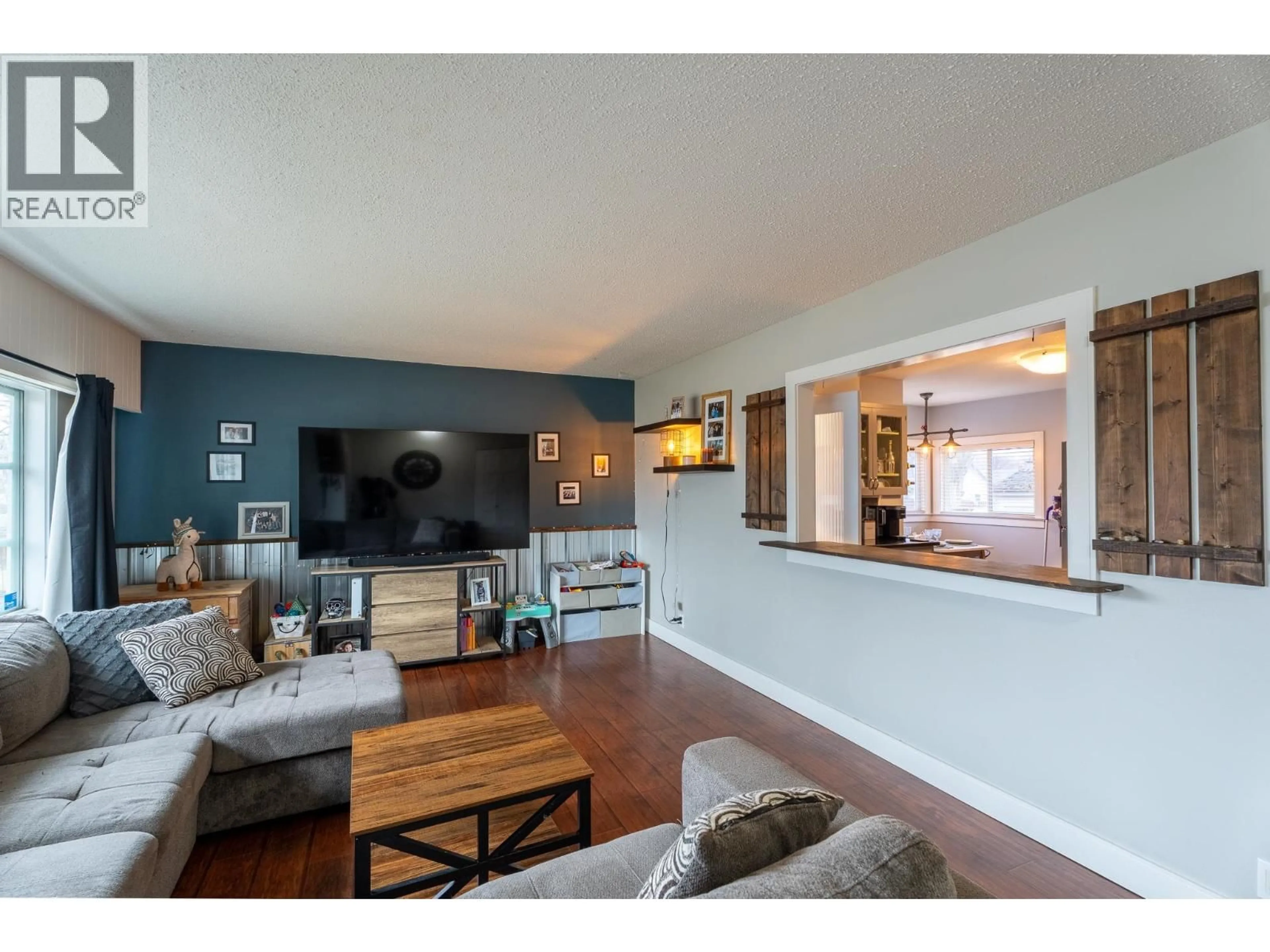 Living room with furniture, wood/laminate floor for 396 BURDEN STREET, Prince George British Columbia V2M2H3