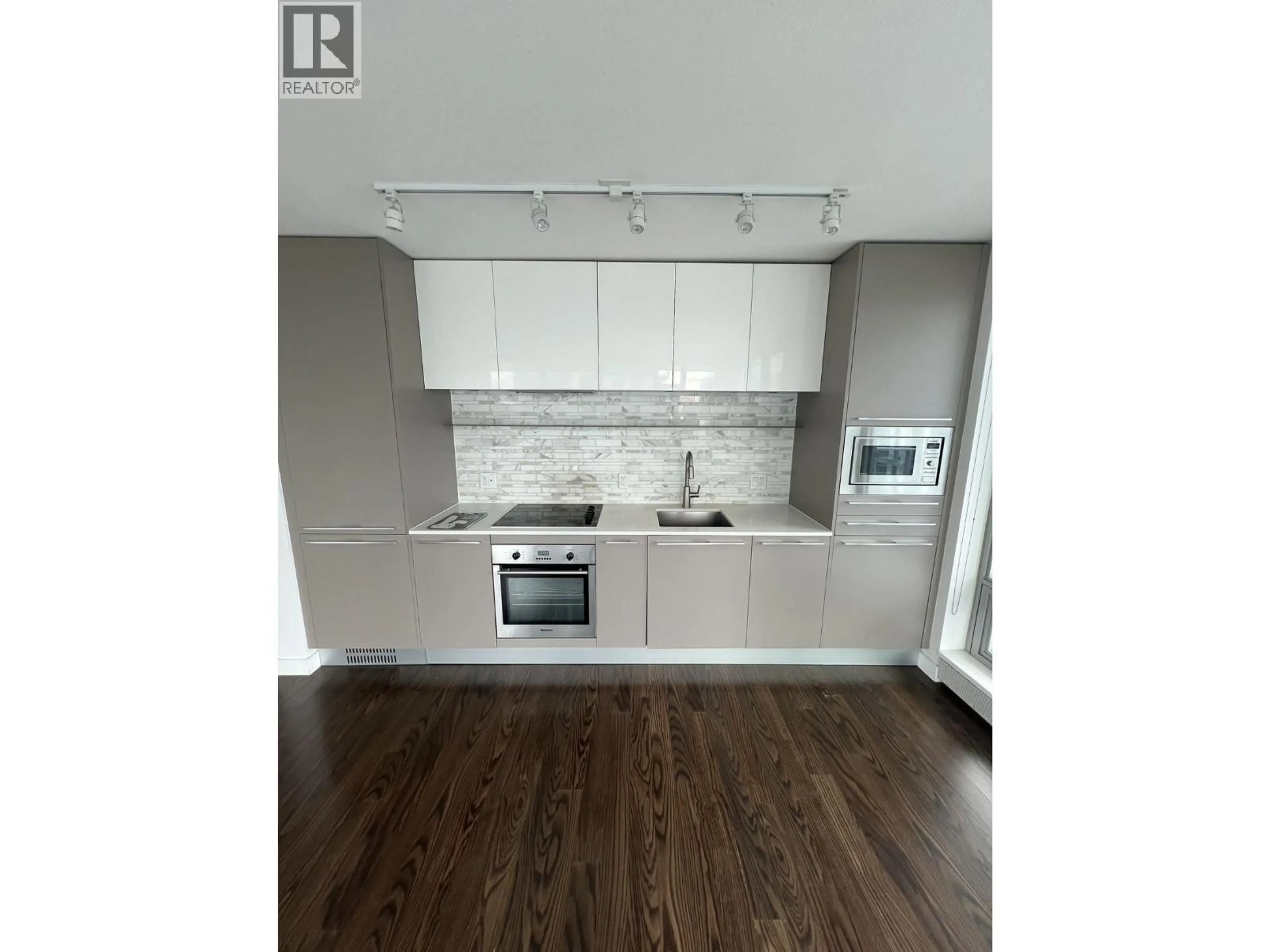 Open concept kitchen, wood/laminate floor for 1706 - 8031 NUNAVUT LANE, Vancouver British Columbia V5X0C9