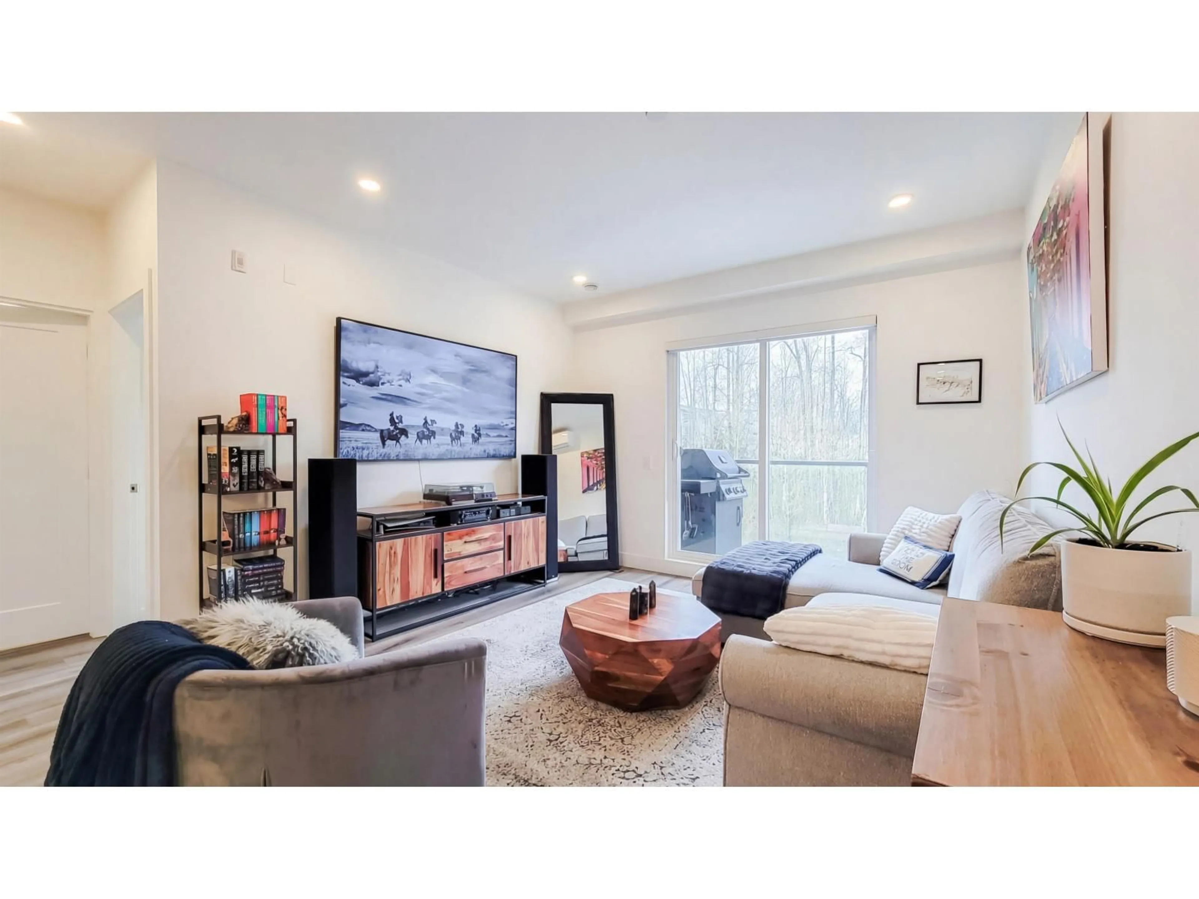 Living room with furniture, wood/laminate floor for B310 - 8447 202 AVENUE, Langley British Columbia V2Y2B7