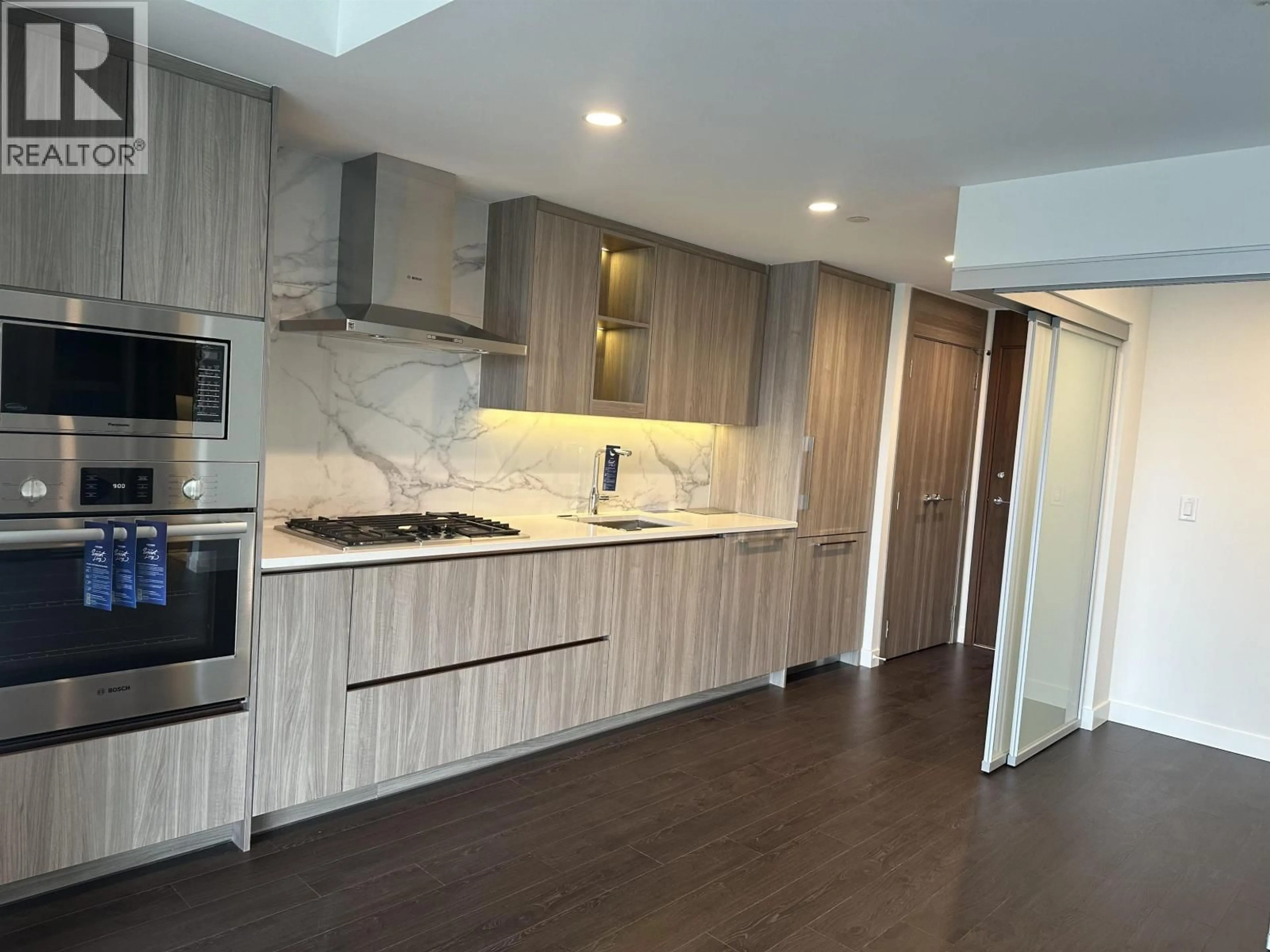 Open concept kitchen, wood/laminate floor for 3008 - 4890 LOUGHEED HIGHWAY, Burnaby British Columbia V5C0N2