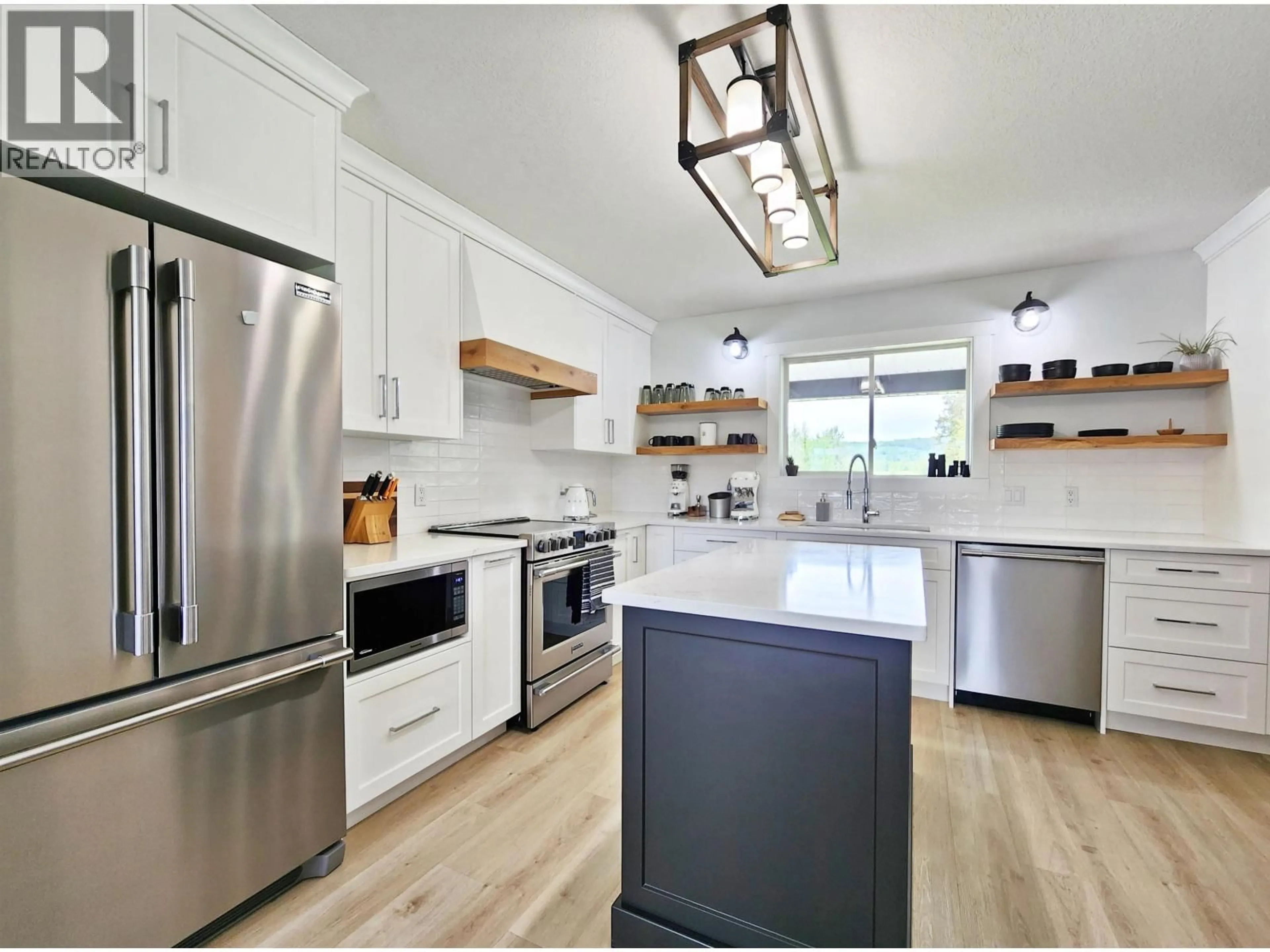 Open concept kitchen, wood/laminate floor for 2312 WEST FRASER ROAD, Quesnel British Columbia V2J6K1