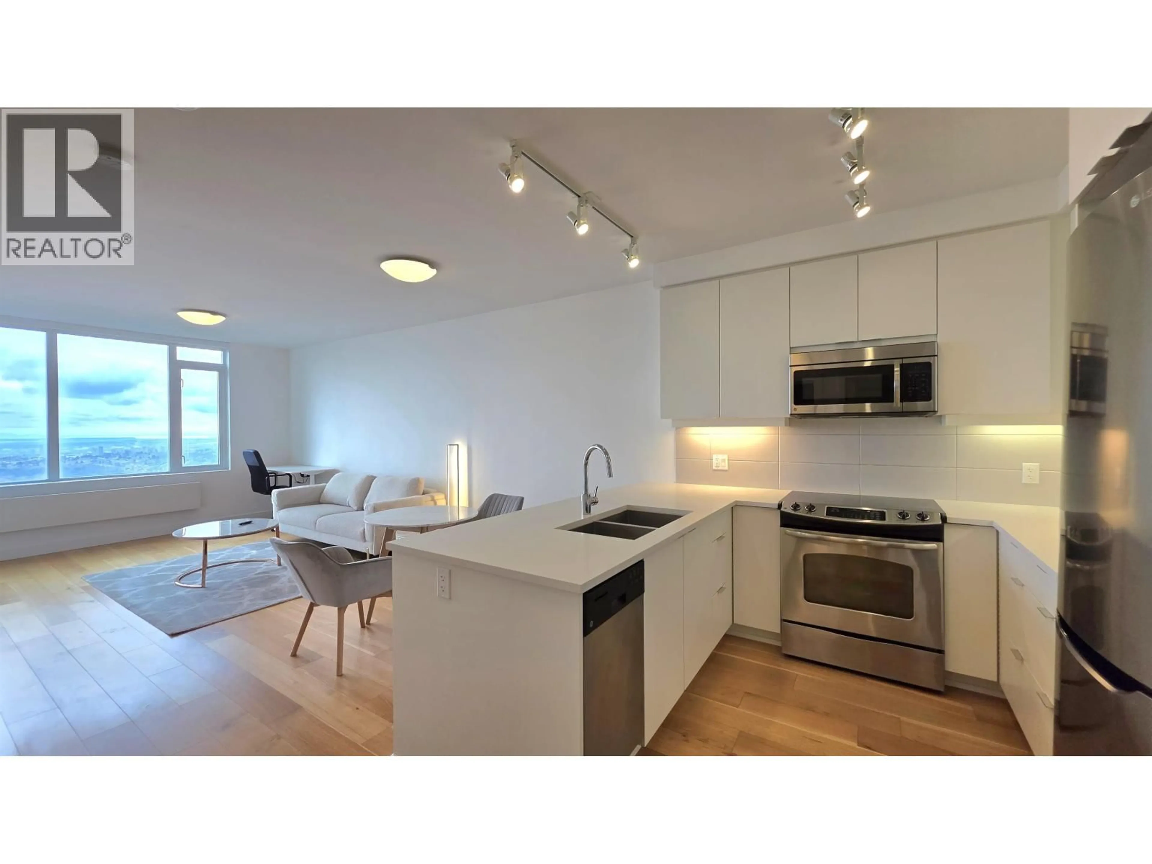 Open concept kitchen, wood/laminate floor for 1505 - 9393 TOWER ROAD, Burnaby British Columbia V5A4Y8