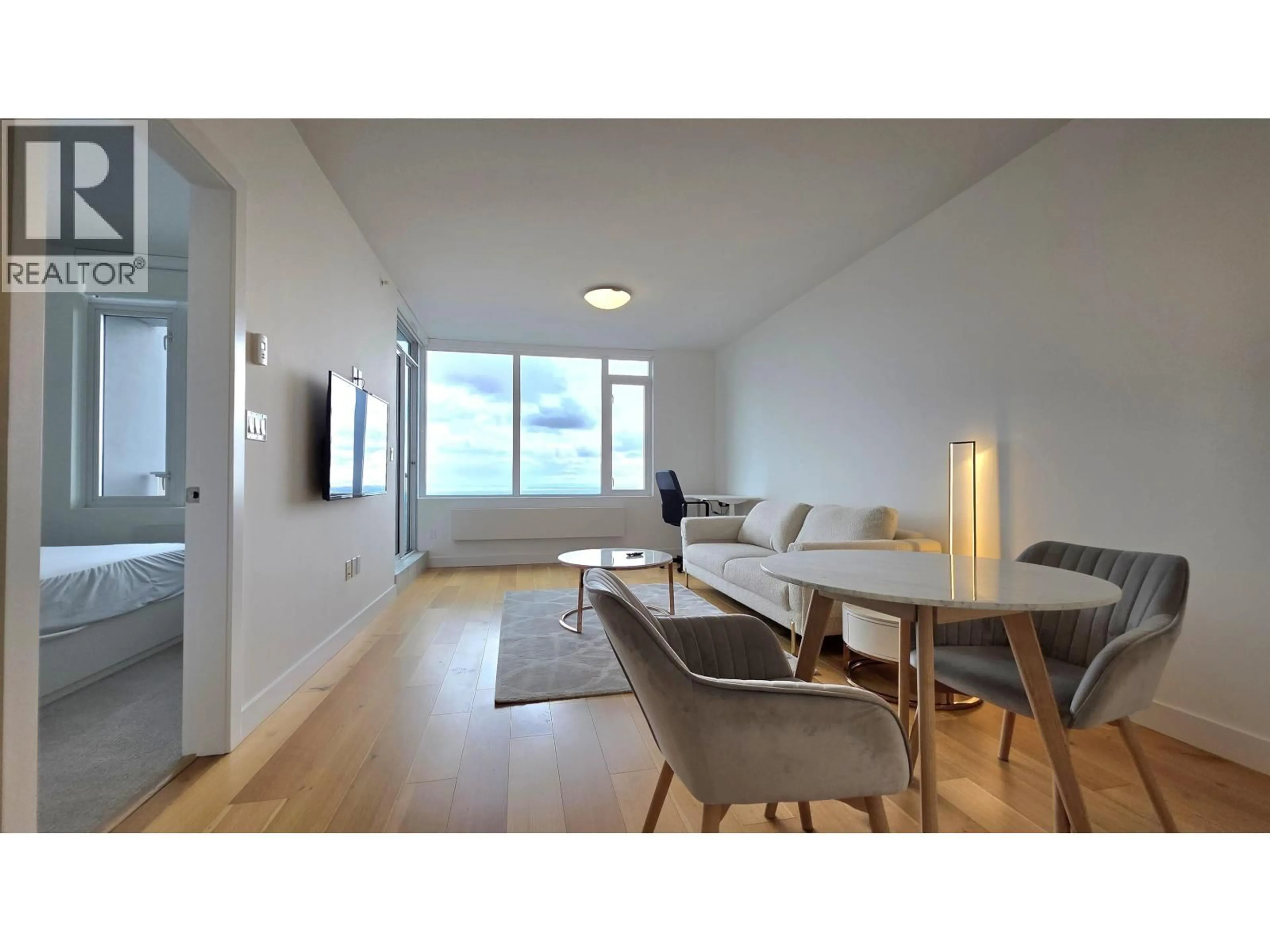 Living room with furniture, wood/laminate floor for 1505 - 9393 TOWER ROAD, Burnaby British Columbia V5A4Y8