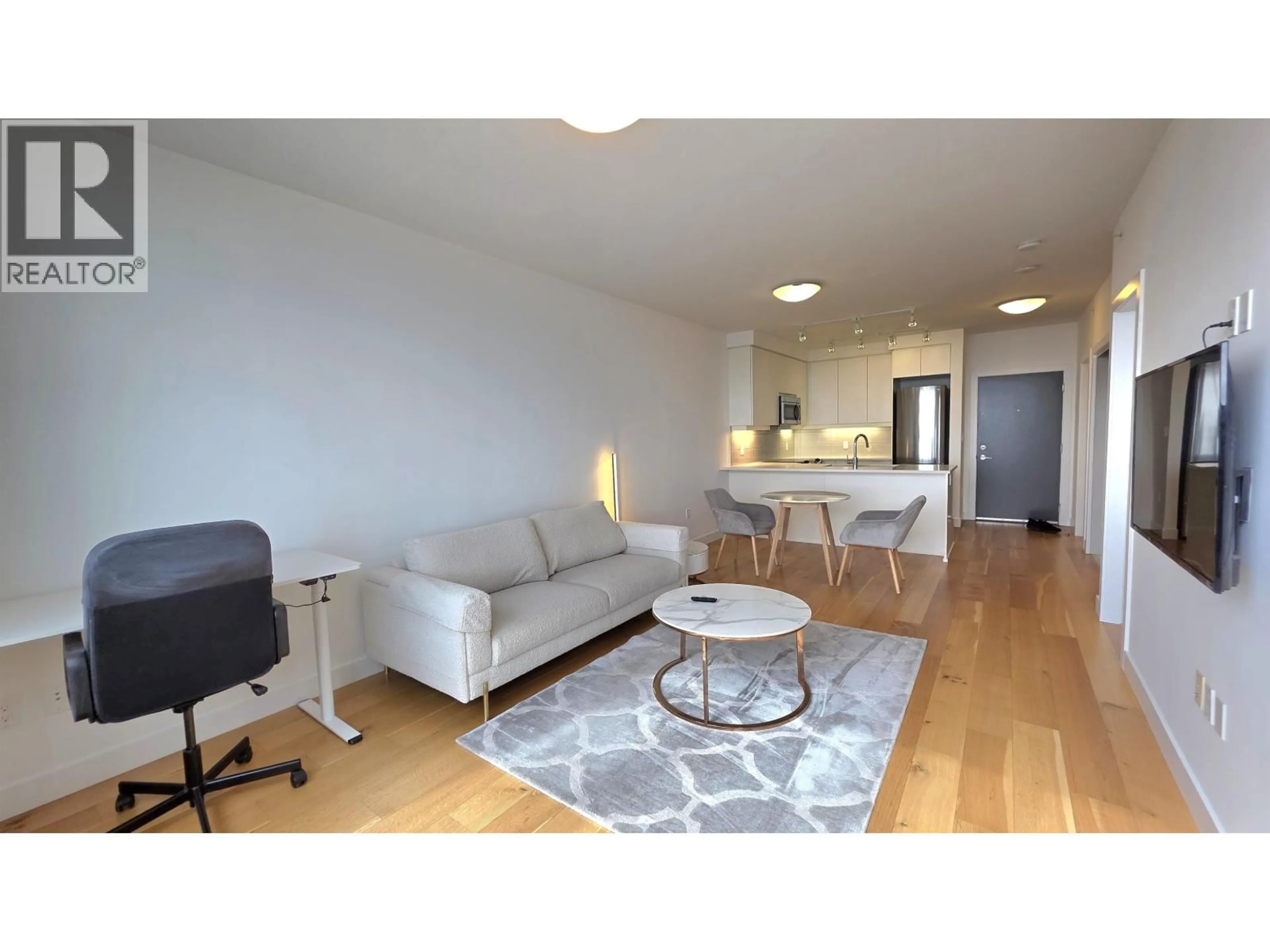 Living room with furniture, wood/laminate floor for 1505 - 9393 TOWER ROAD, Burnaby British Columbia V5A4Y8