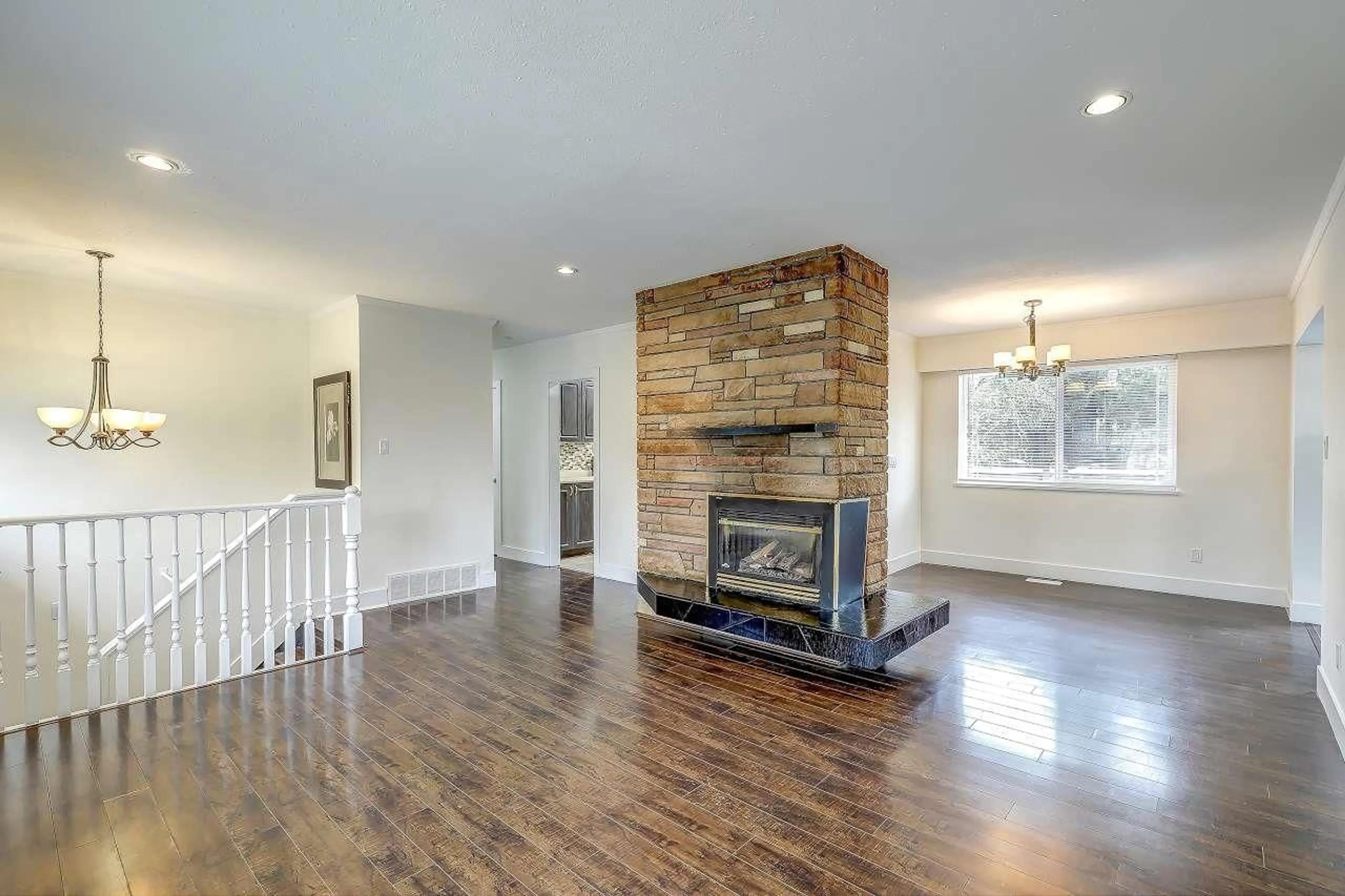 Living room with furniture, wood/laminate floor for 10055 122 STREET, Surrey British Columbia V3V4M6