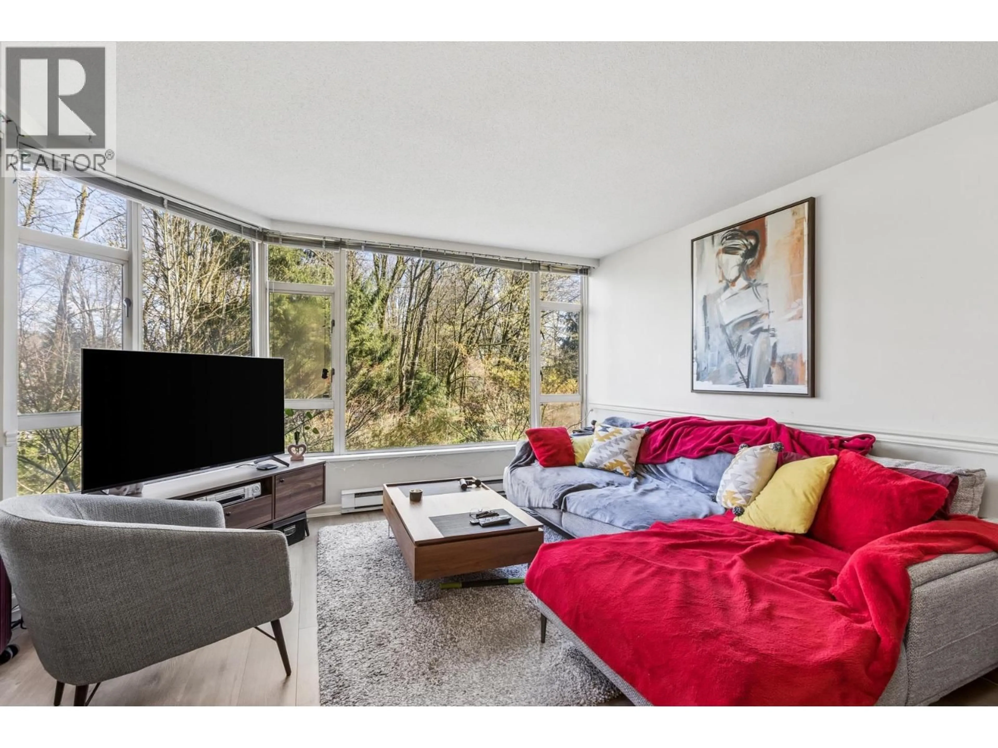 Living room with furniture, wood/laminate floor for 308 - 1327 KEITH ROAD, North Vancouver British Columbia V7J3T5