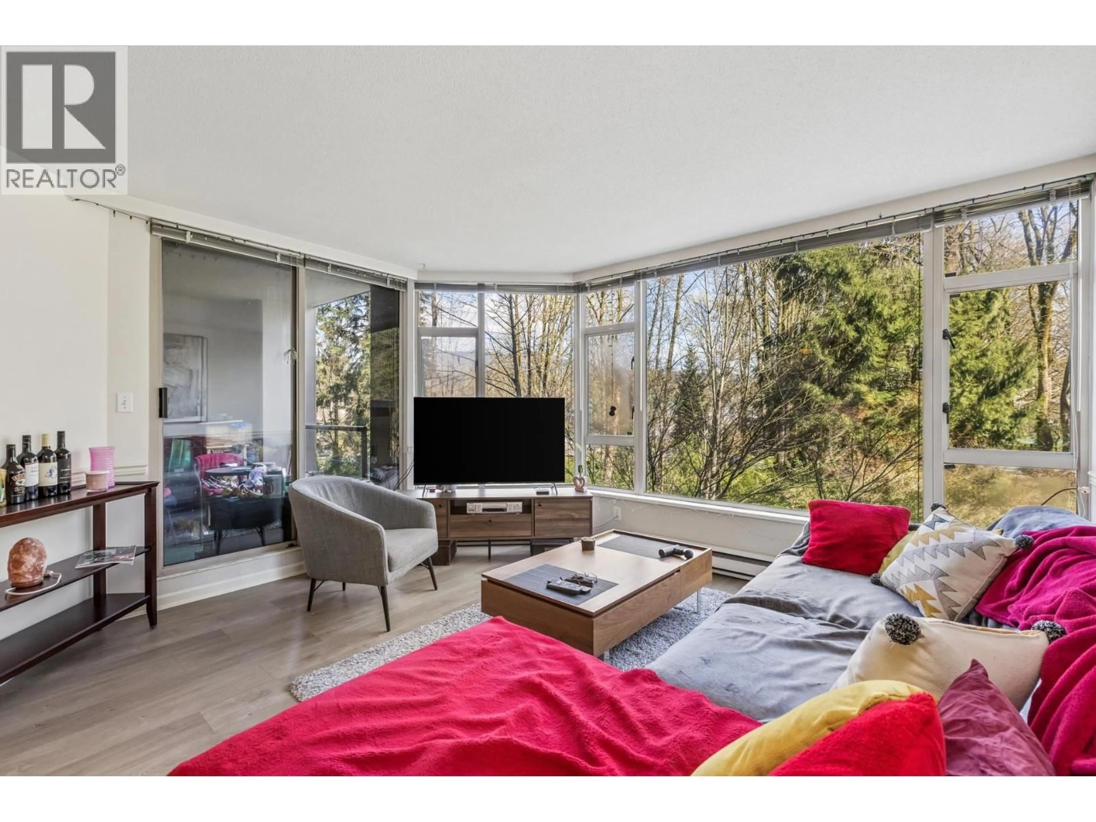 Living room with furniture, wood/laminate floor for 308 - 1327 KEITH ROAD, North Vancouver British Columbia V7J3T5