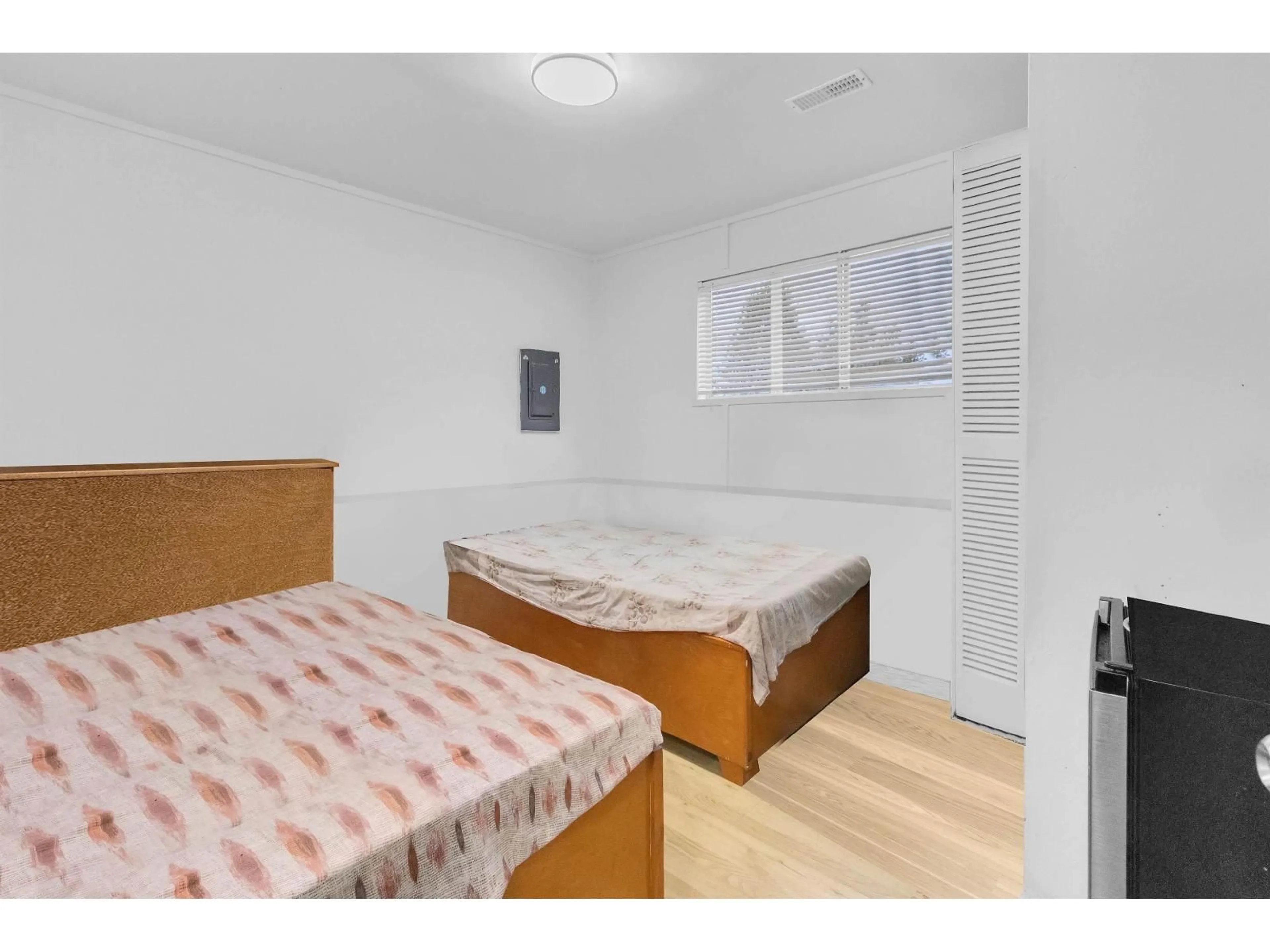 Bedroom with bed, wood/laminate floor for 9892 130 STREET, Surrey British Columbia V3T3L4