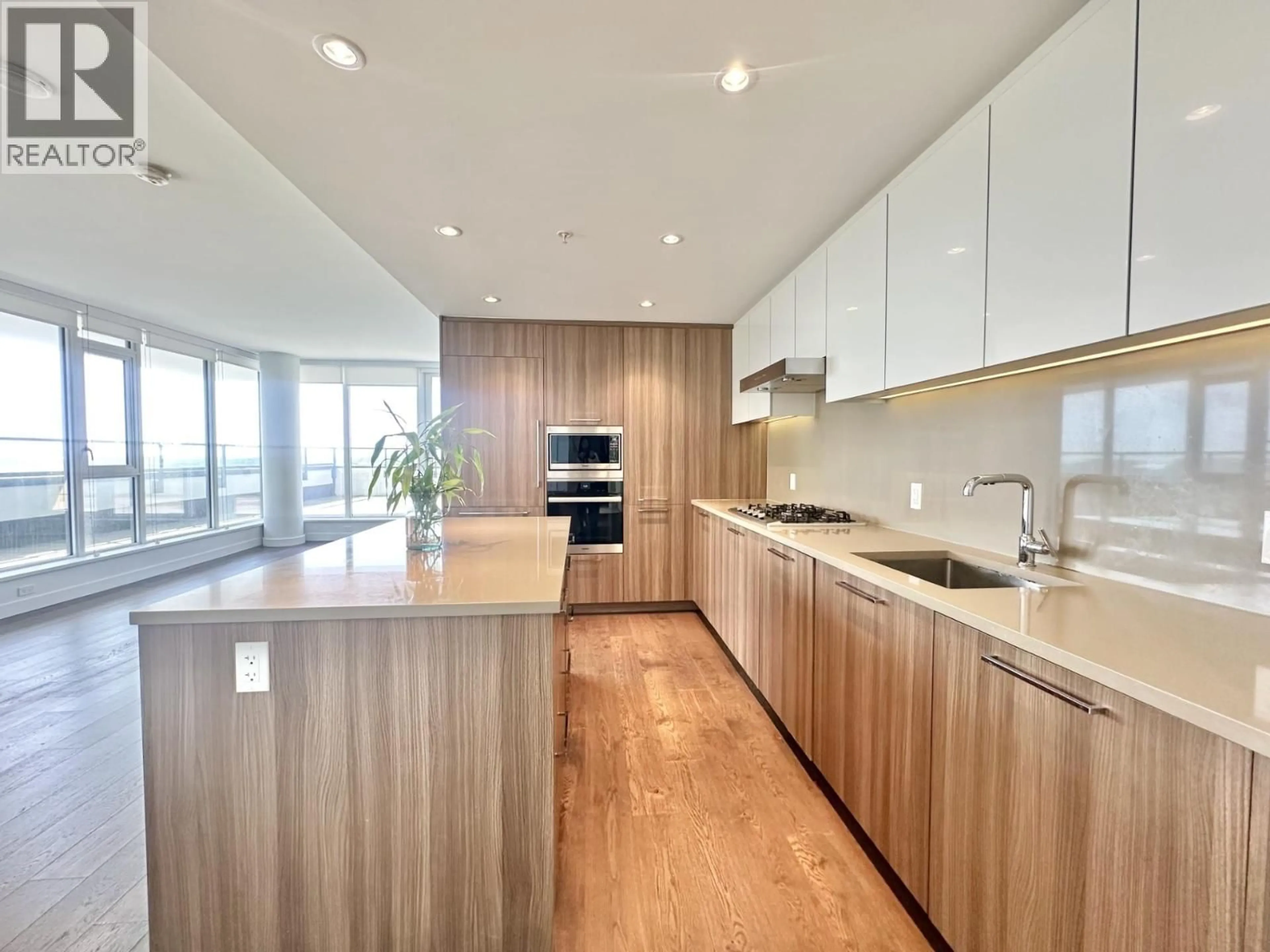 Contemporary kitchen, wood/laminate floor for 1005 - 3280 CORVETTE WAY, Richmond British Columbia V6X0T9