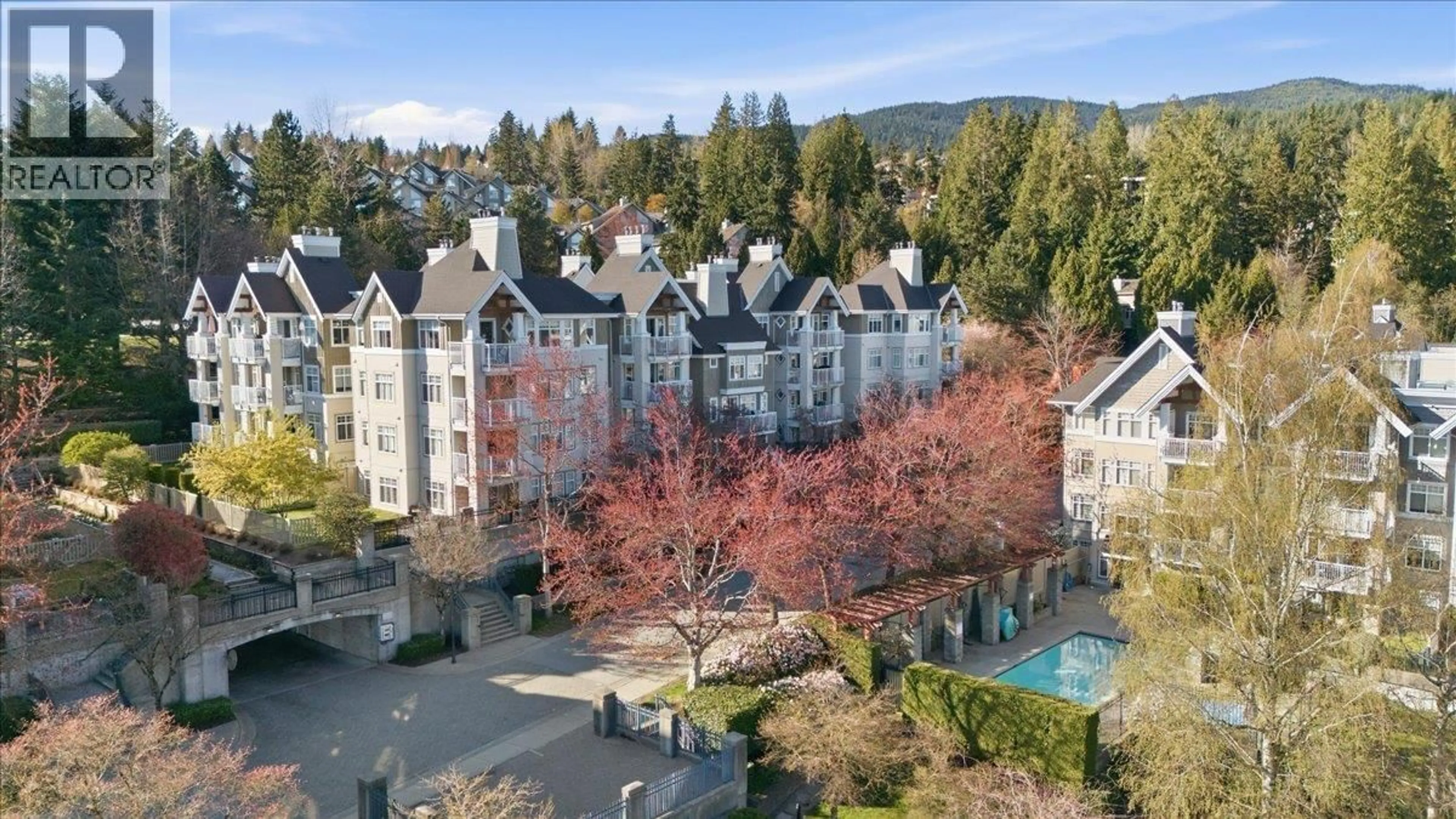 A pic from outside/outdoor area/front of a property/back of a property/a pic from drone, mountain view for 212 - 1428 PARKWAY BOULEVARD, Coquitlam British Columbia V3E3L8