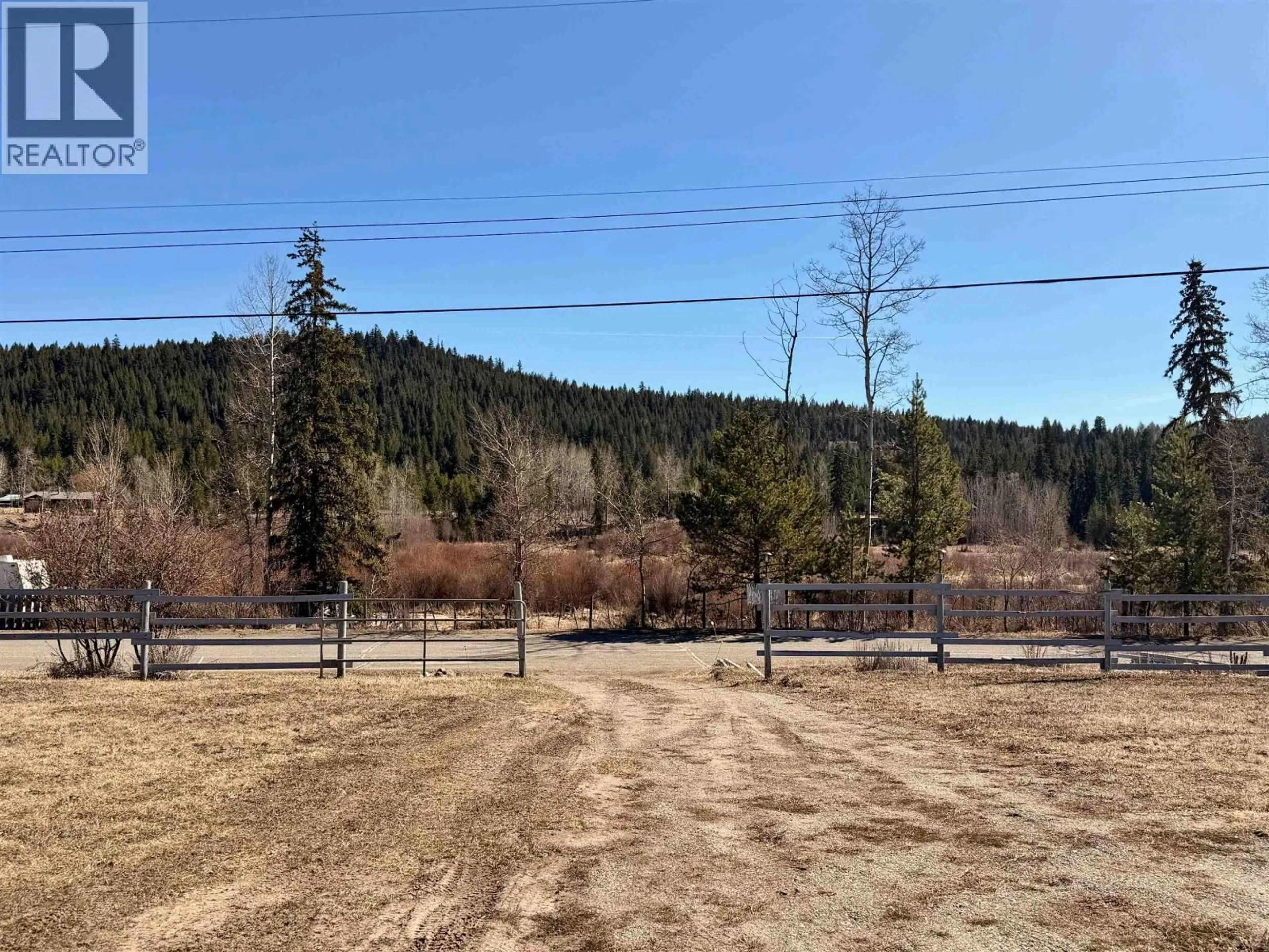 A pic from outside/outdoor area/front of a property/back of a property/a pic from drone, forest/trees view for 5118 PERKINS ROAD, 100 Mile House British Columbia V0K1G0