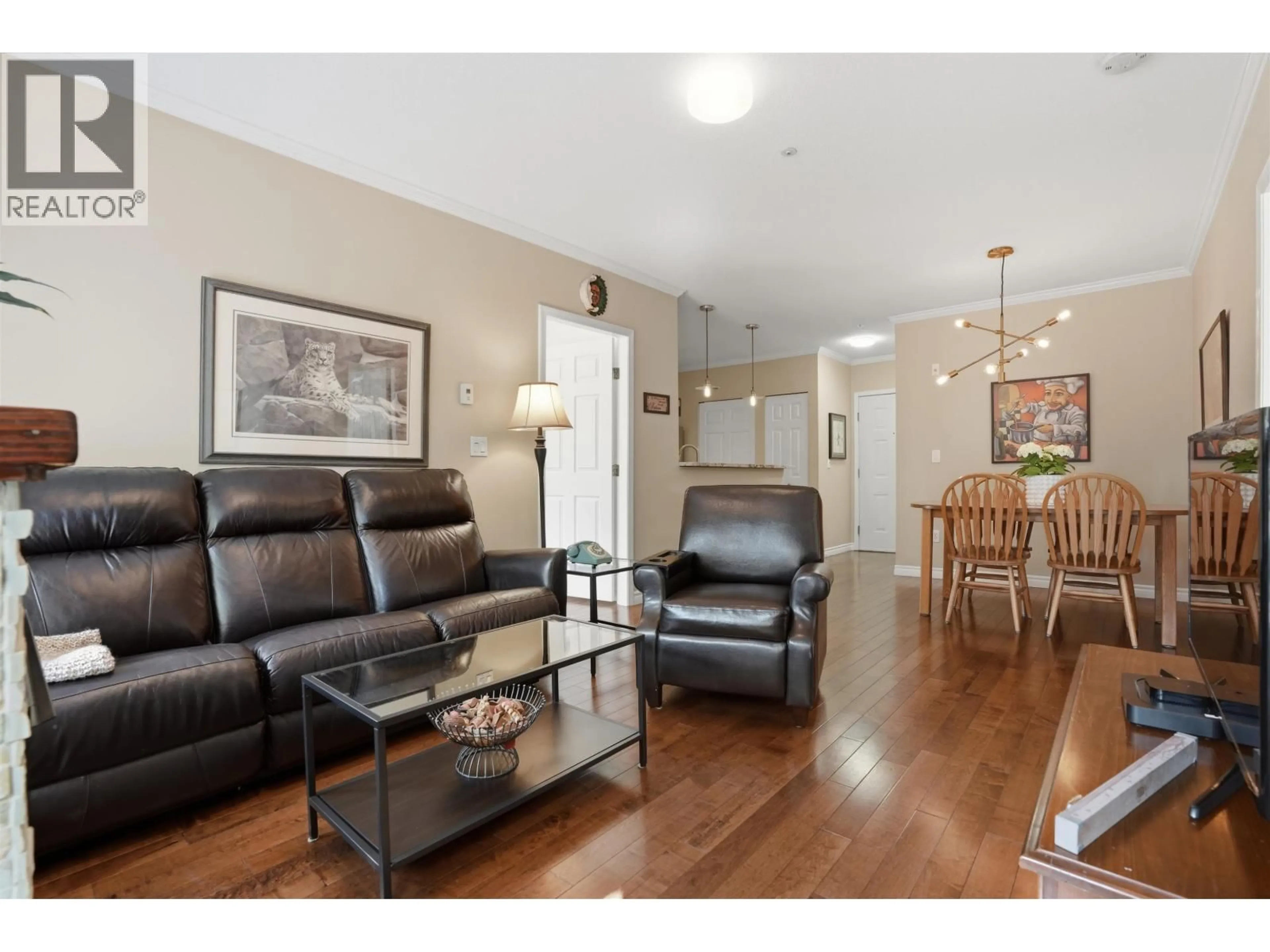 Living room with furniture, wood/laminate floor for 107 - 5555 13A AVENUE, Delta British Columbia V4M2E7