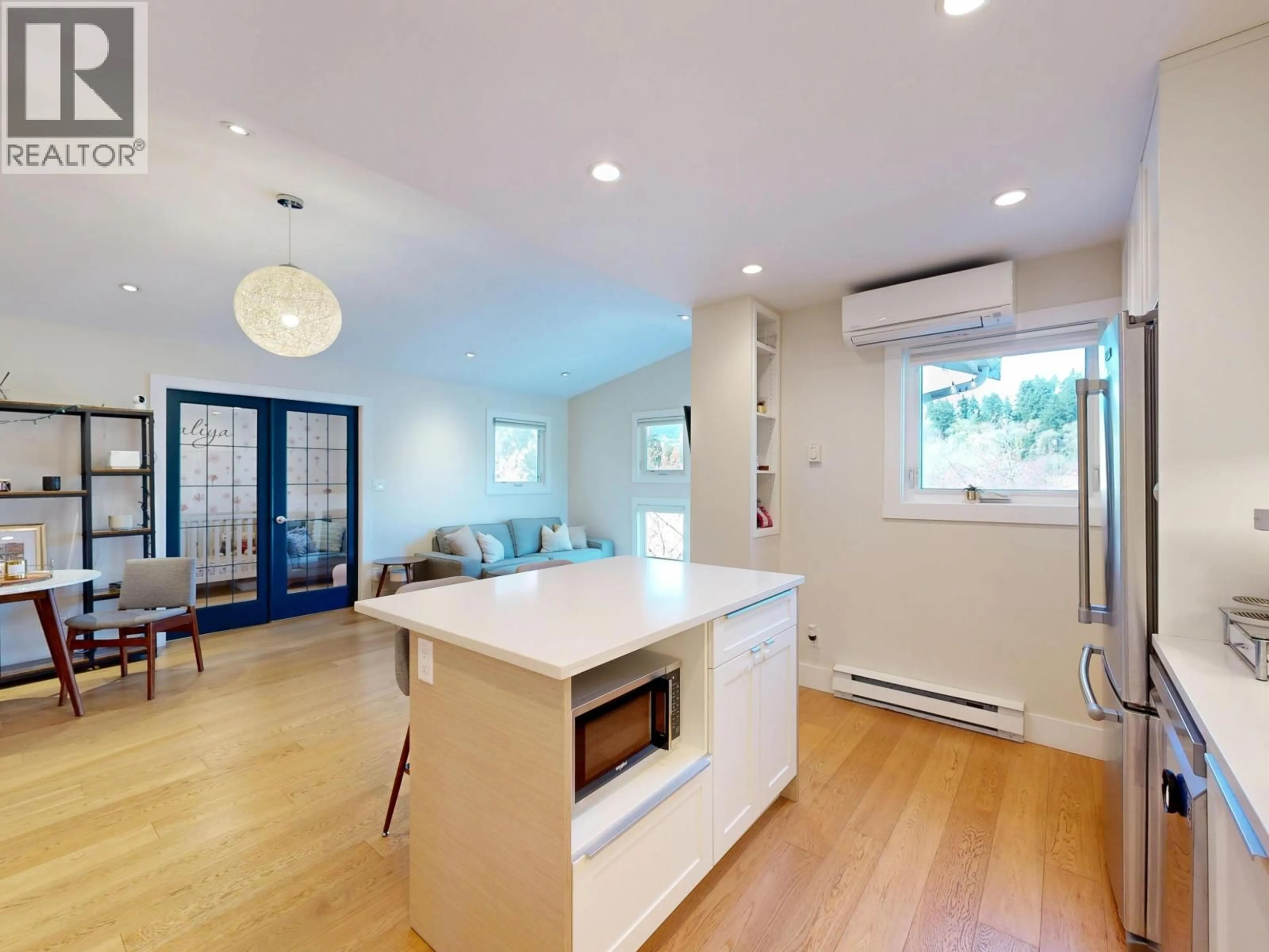 Open concept kitchen, wood/laminate floor for 304 - 1528 BOWSER AVENUE, North Vancouver British Columbia V7P2Y3