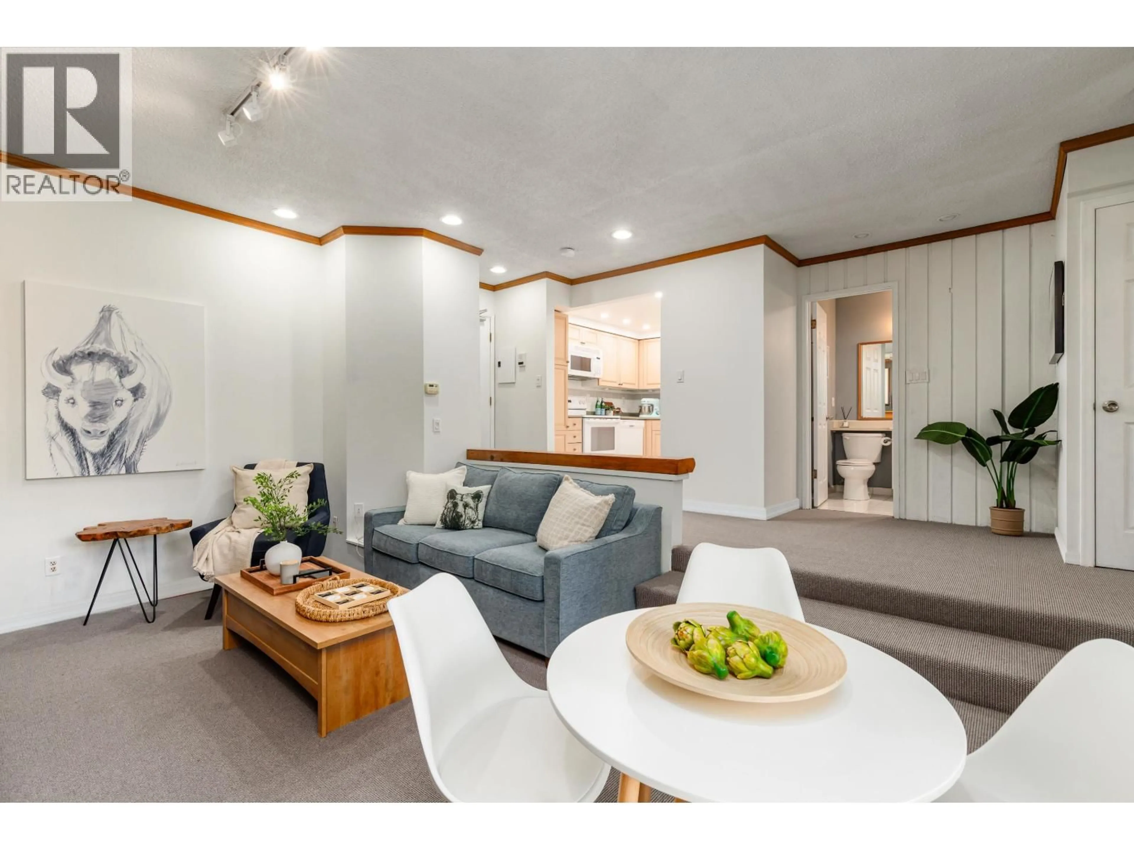 Living room with furniture, wood/laminate floor for A201 - 1400 ALTA LAKE ROAD, Whistler British Columbia V8E0G9