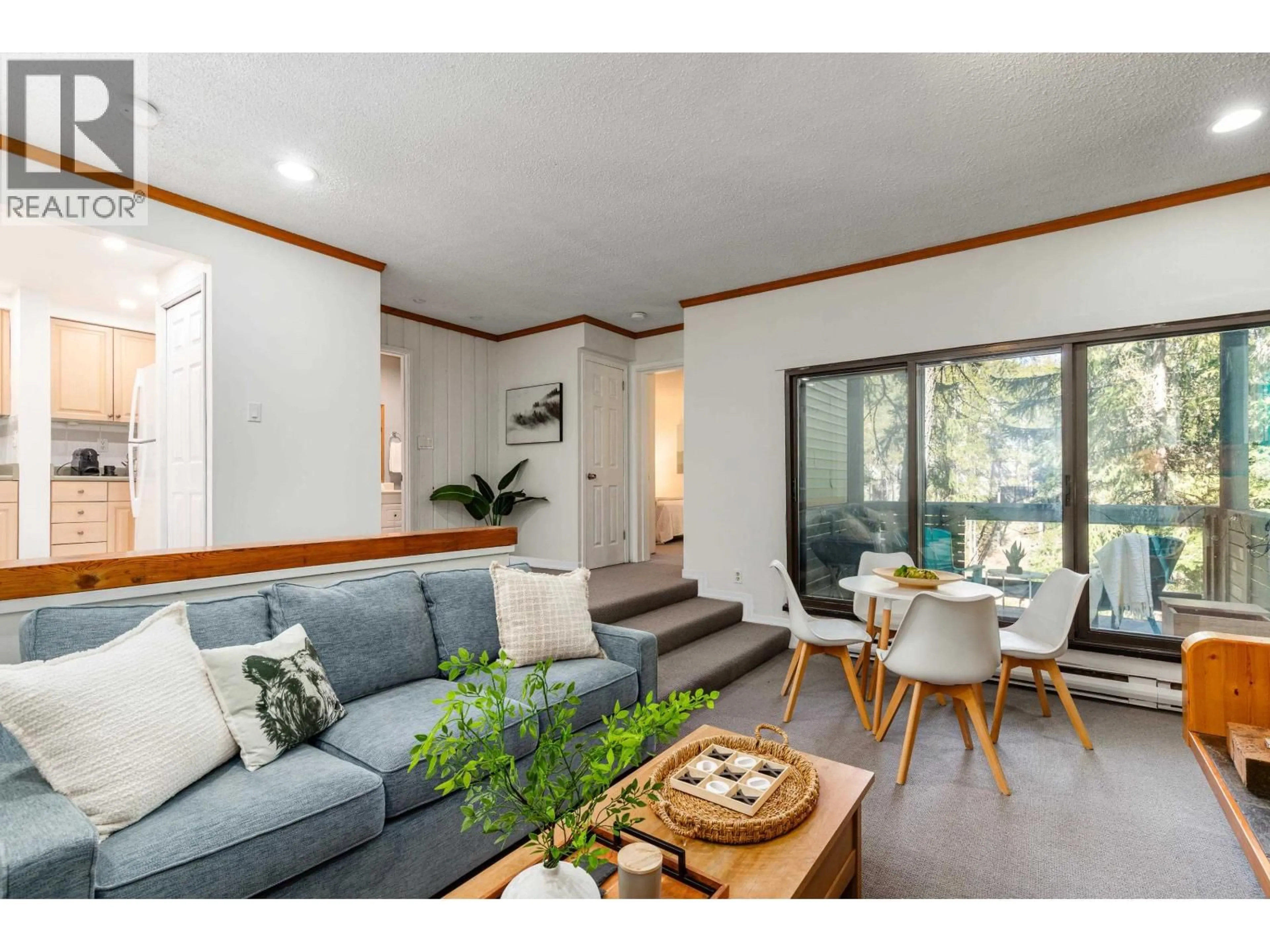 Living room with furniture, wood/laminate floor for A201 - 1400 ALTA LAKE ROAD, Whistler British Columbia V8E0G9