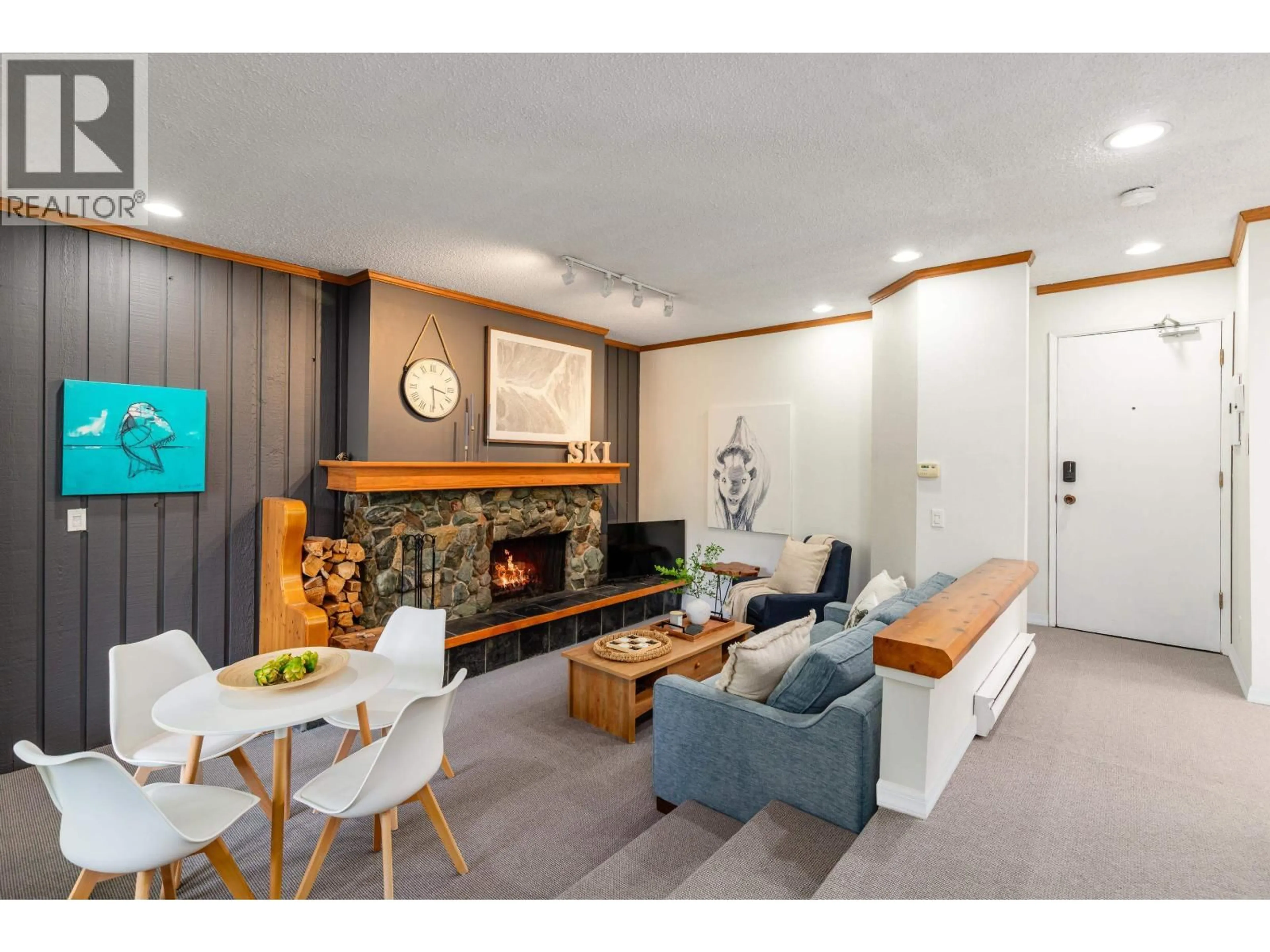 Living room with furniture, wood/laminate floor for A201 - 1400 ALTA LAKE ROAD, Whistler British Columbia V8E0G9