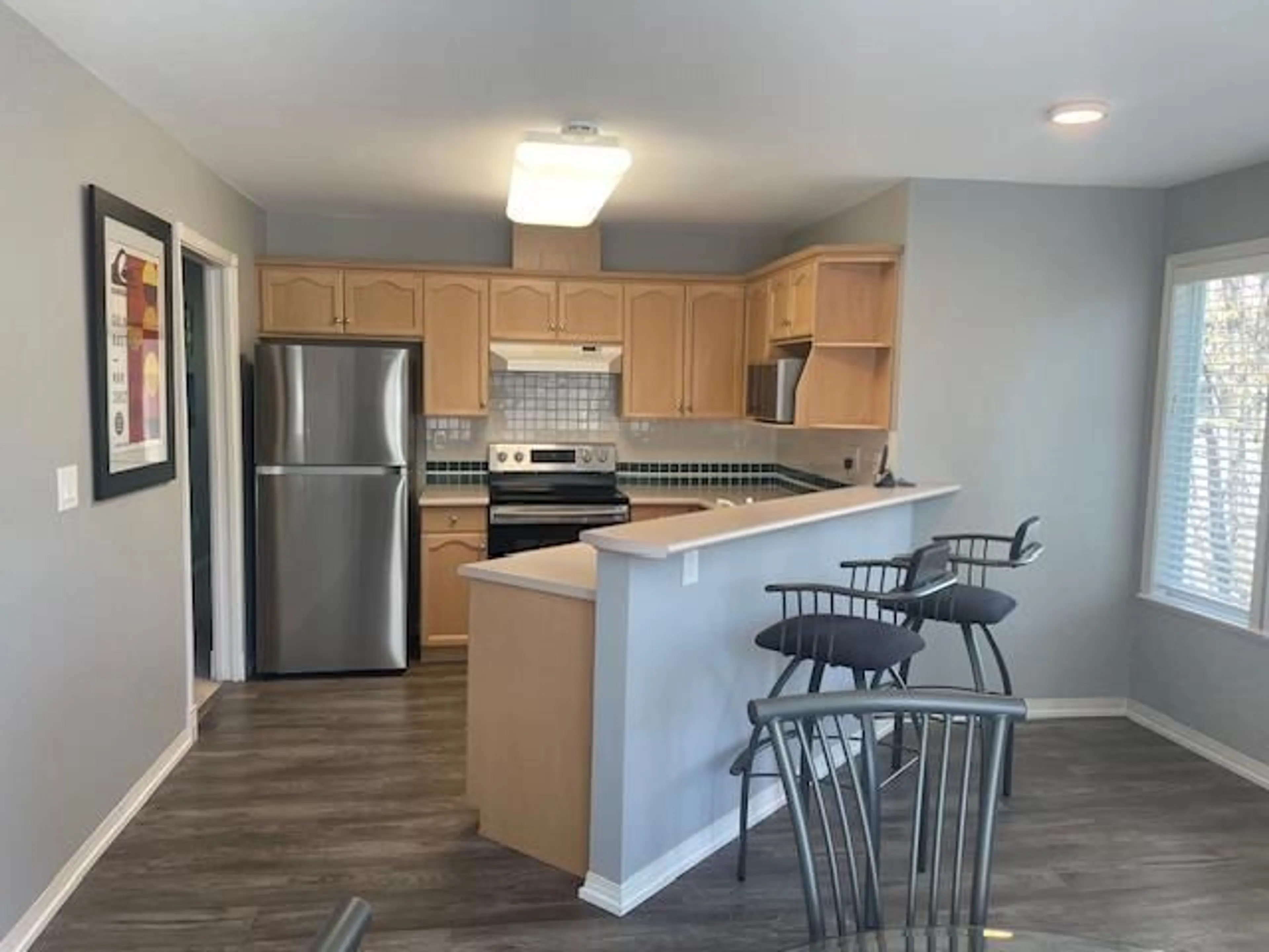Open concept kitchen, wood/laminate floor for 36 - 4740 221 STREET, Langley British Columbia V3A8H1