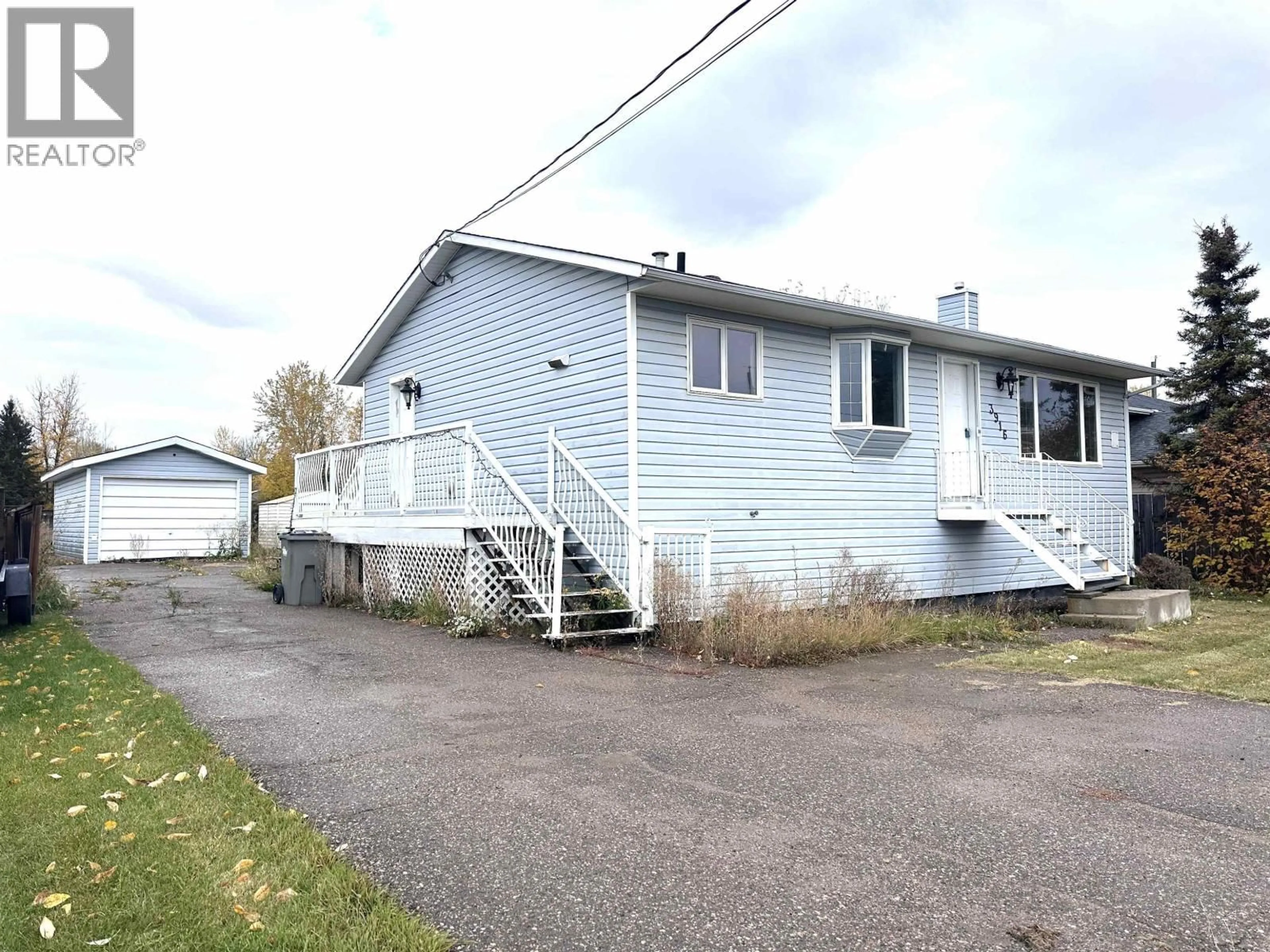 A pic from outside/outdoor area/front of a property/back of a property/a pic from drone, street for 3916 COTTONWOOD ROAD, Fort Nelson British Columbia V0C1R0