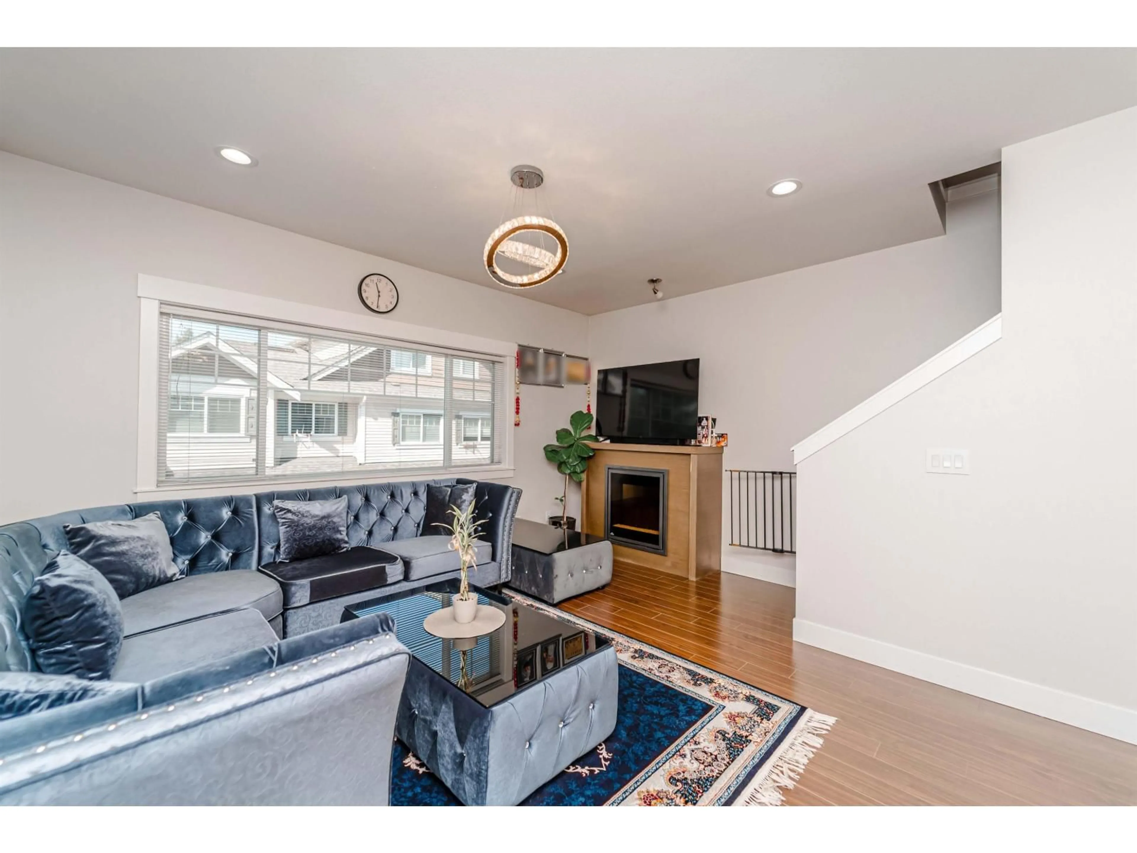 Living room with furniture, wood/laminate floor for 30 - 30748 CARDINAL AVENUE, Abbotsford British Columbia V2T5P5