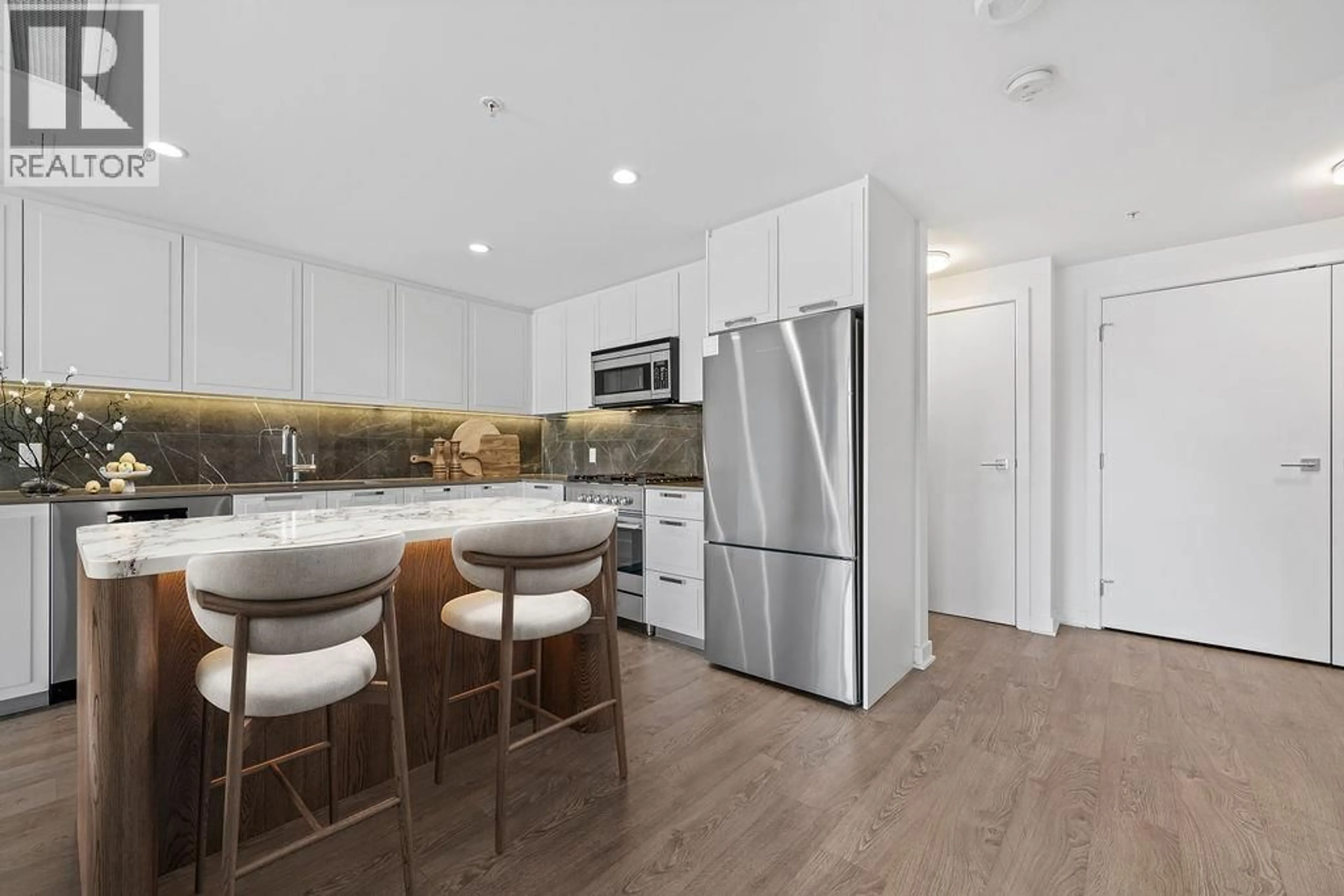 Open concept kitchen, wood/laminate floor for 1308 - 1471 HUNTER STREET, North Vancouver British Columbia V7J1H3
