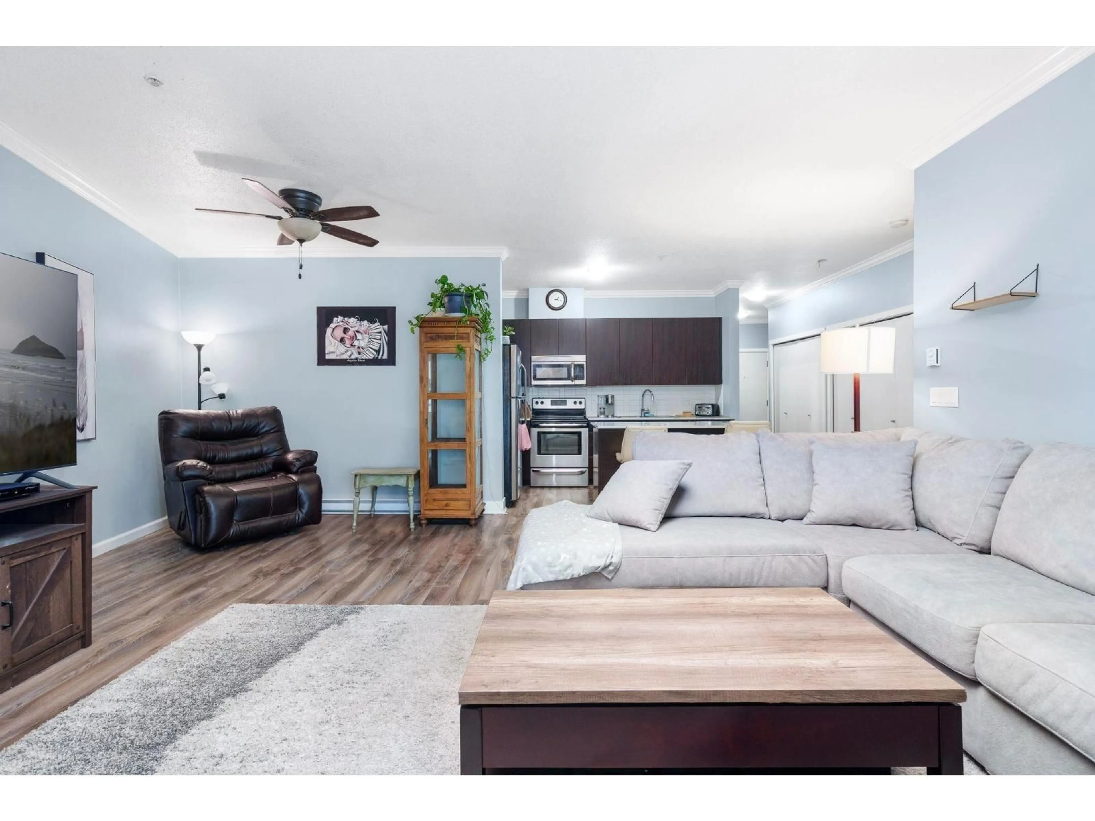 Living room with furniture, wood/laminate floor for 318 - 20460 DOUGLAS CRESCENT, Langley British Columbia V3A0C6