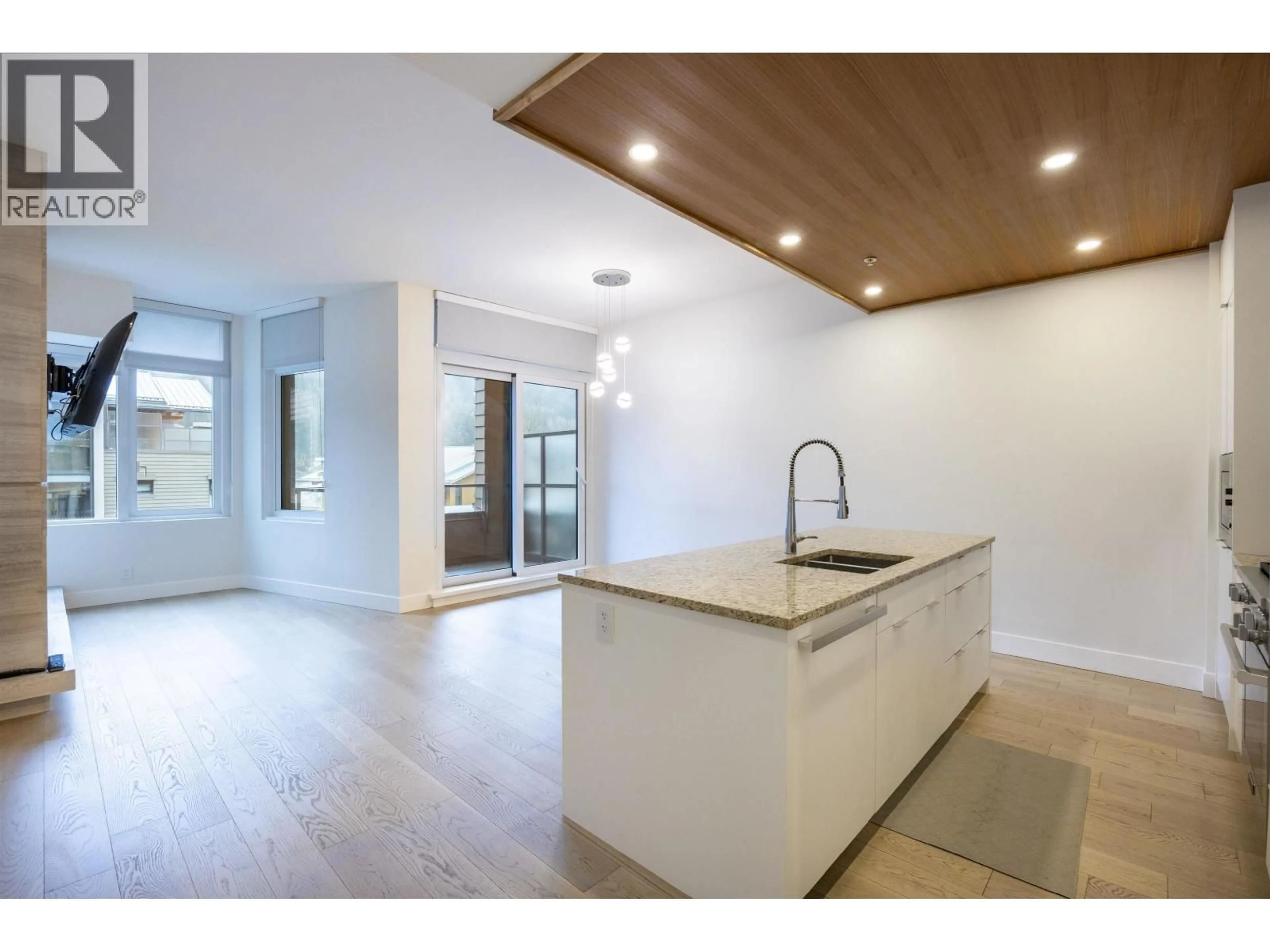 Open concept kitchen, wood/laminate floor for 406 - 6687 NELSON AVENUE, Vancouver British Columbia V7W2B2